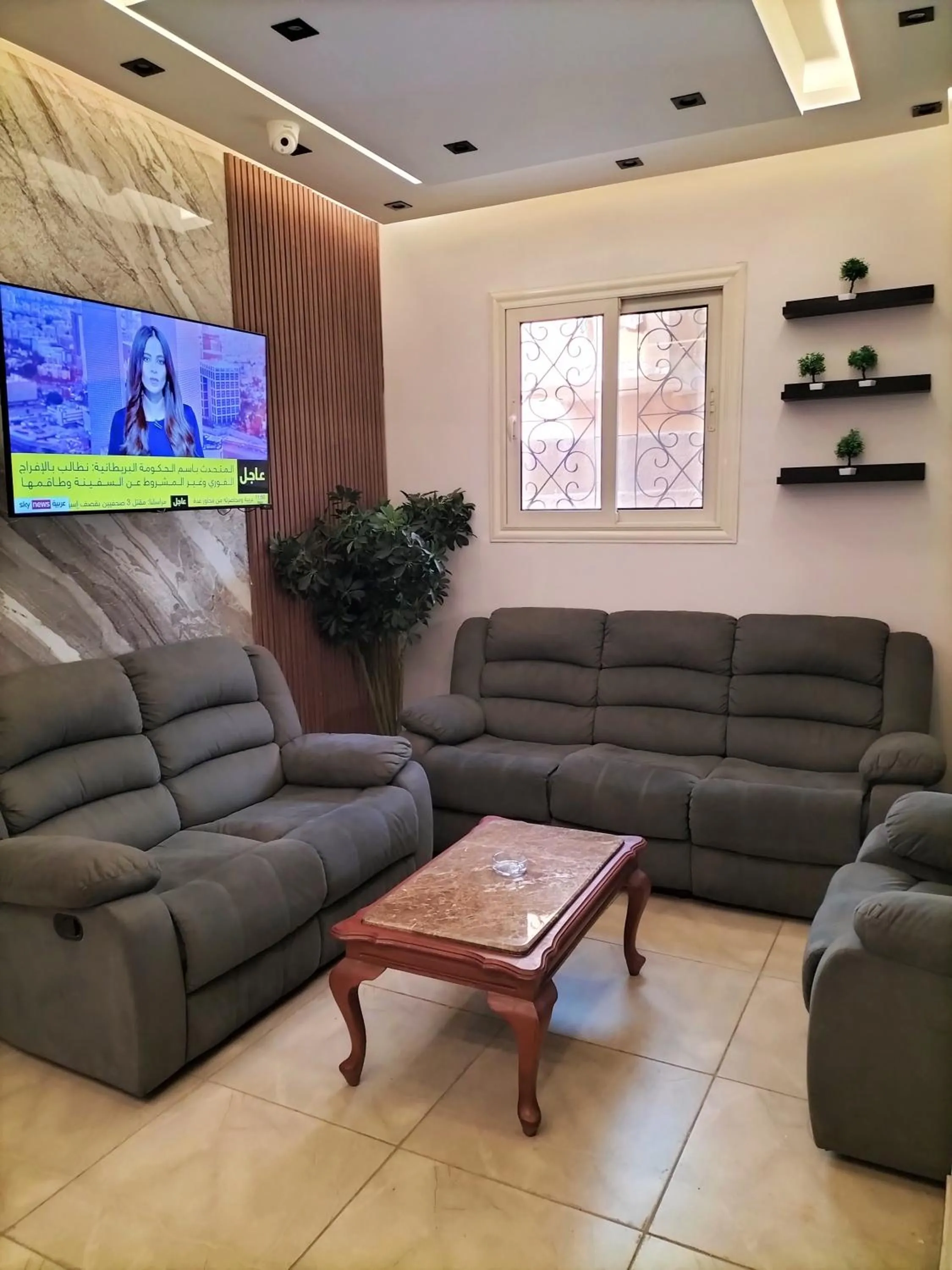 Communal lounge/ TV room in Sun and Sand Guest House