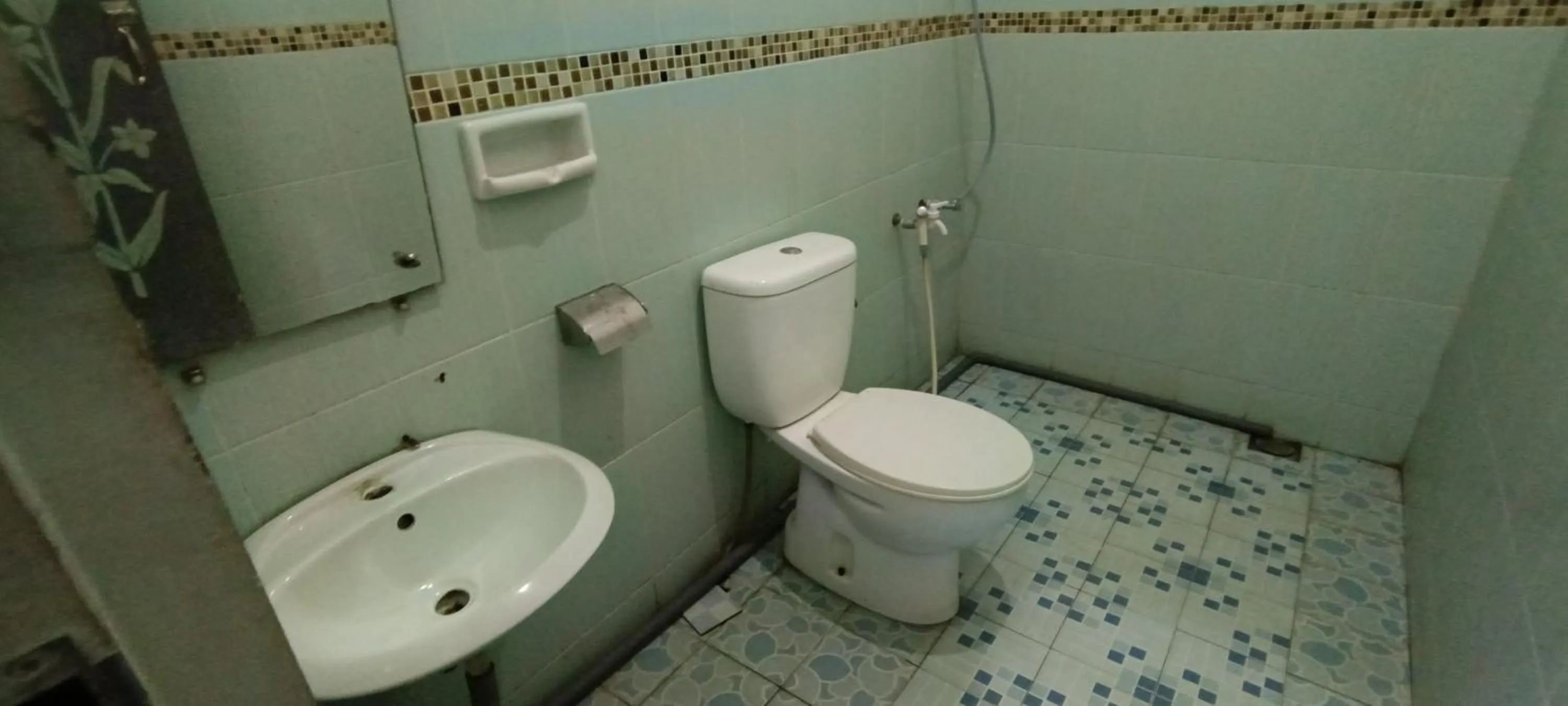 Bathroom in Hotel O Wisma Hamalau SyariahNearPulau Bromo Pedestrian Bridge