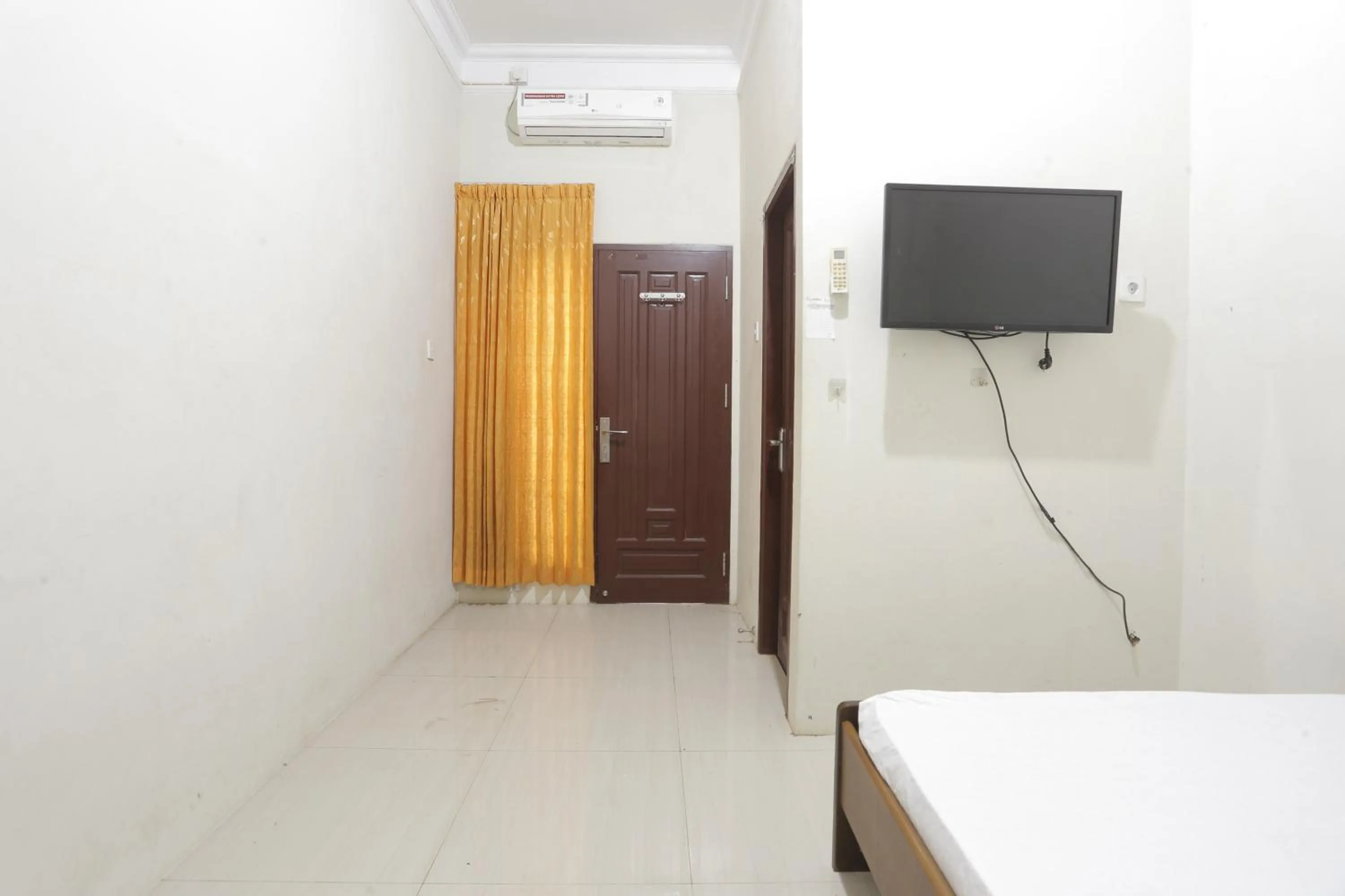 Bedroom in Hotel O Penginapan Budhe Sri