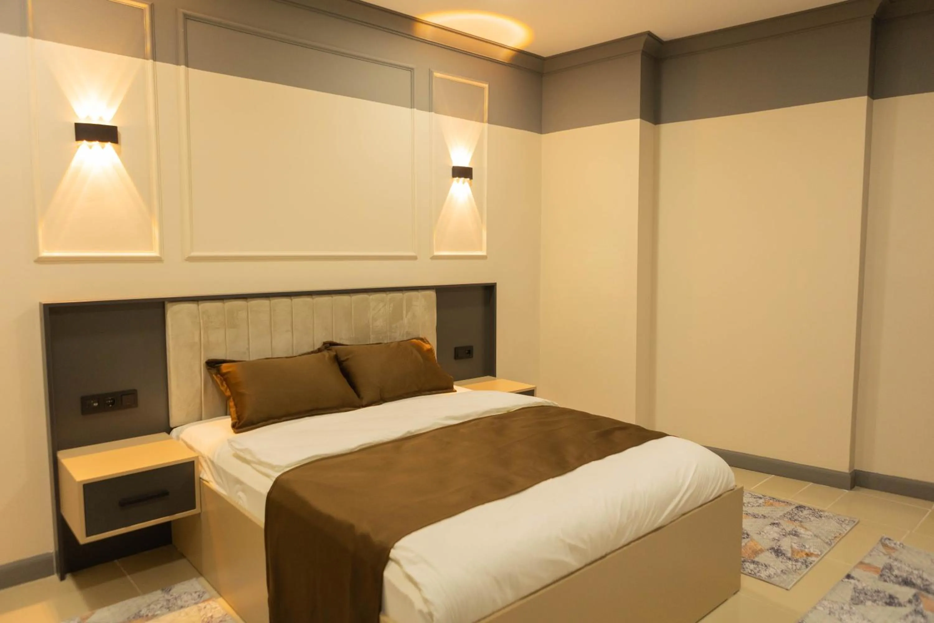 Bed in City Night Suites & Hotels