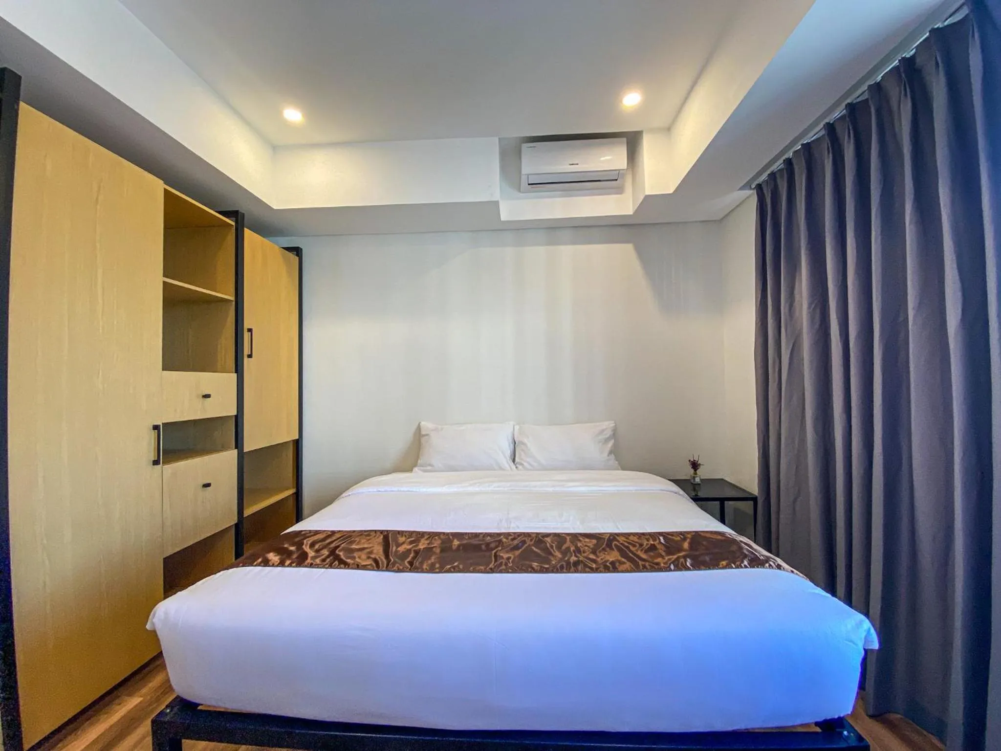 Bed in Wesfame Suites