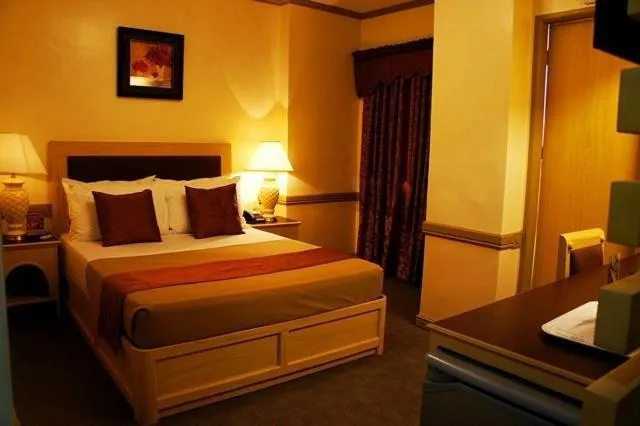 Bed in PHELA GRANDE HOTEL