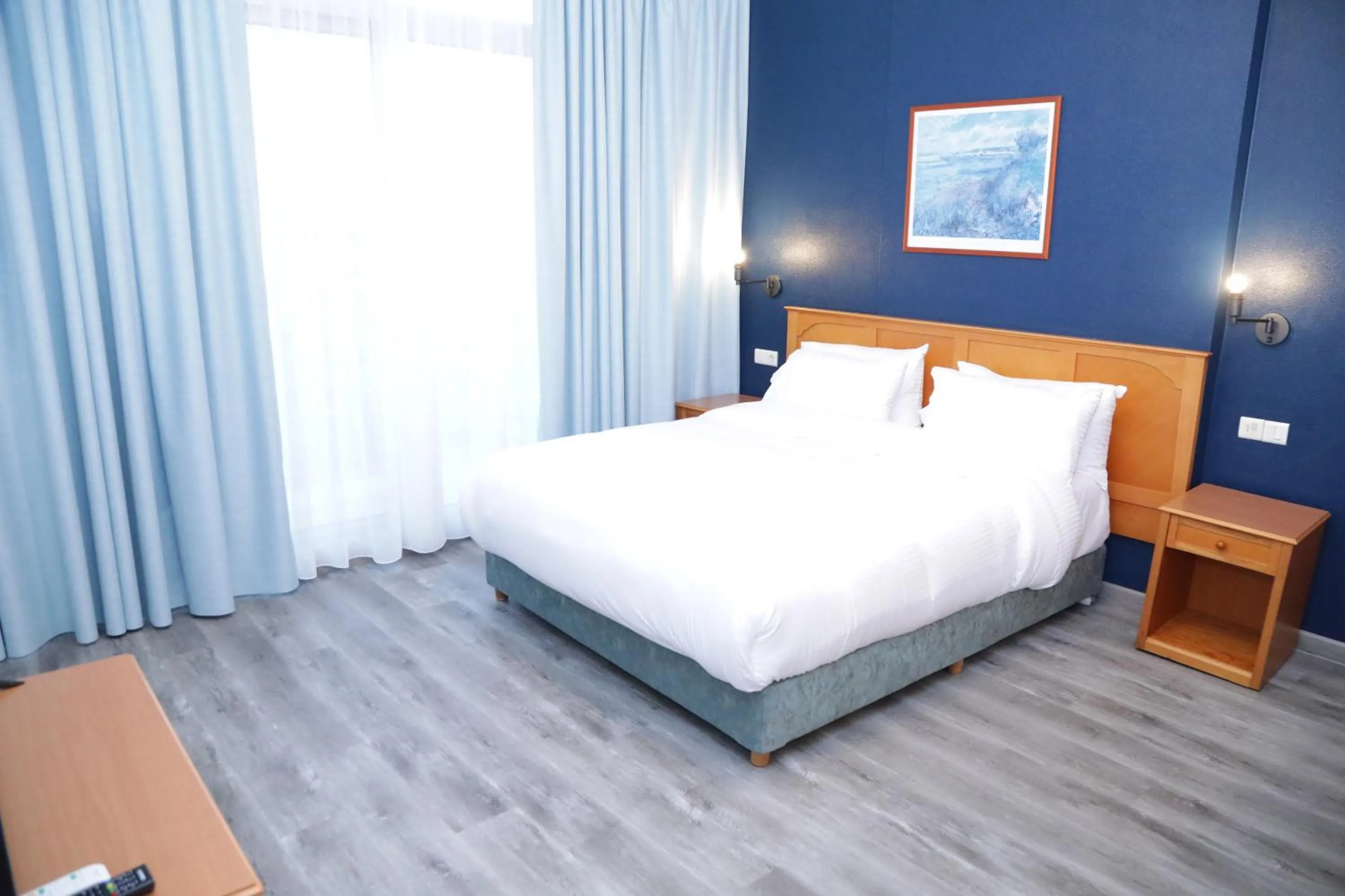 Bed in El Sheikh Suites Hotel