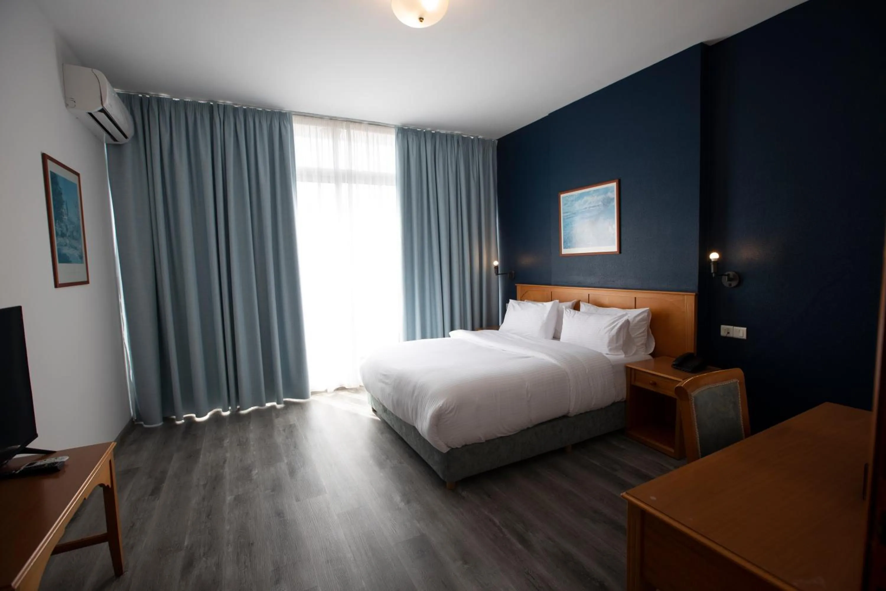 Bed in El Sheikh Suites Hotel