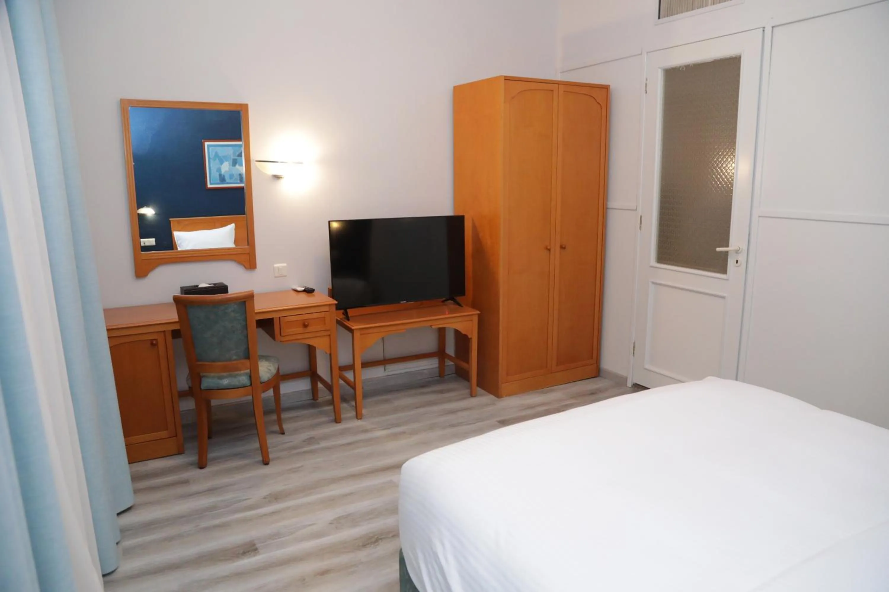 Bed in El Sheikh Suites Hotel