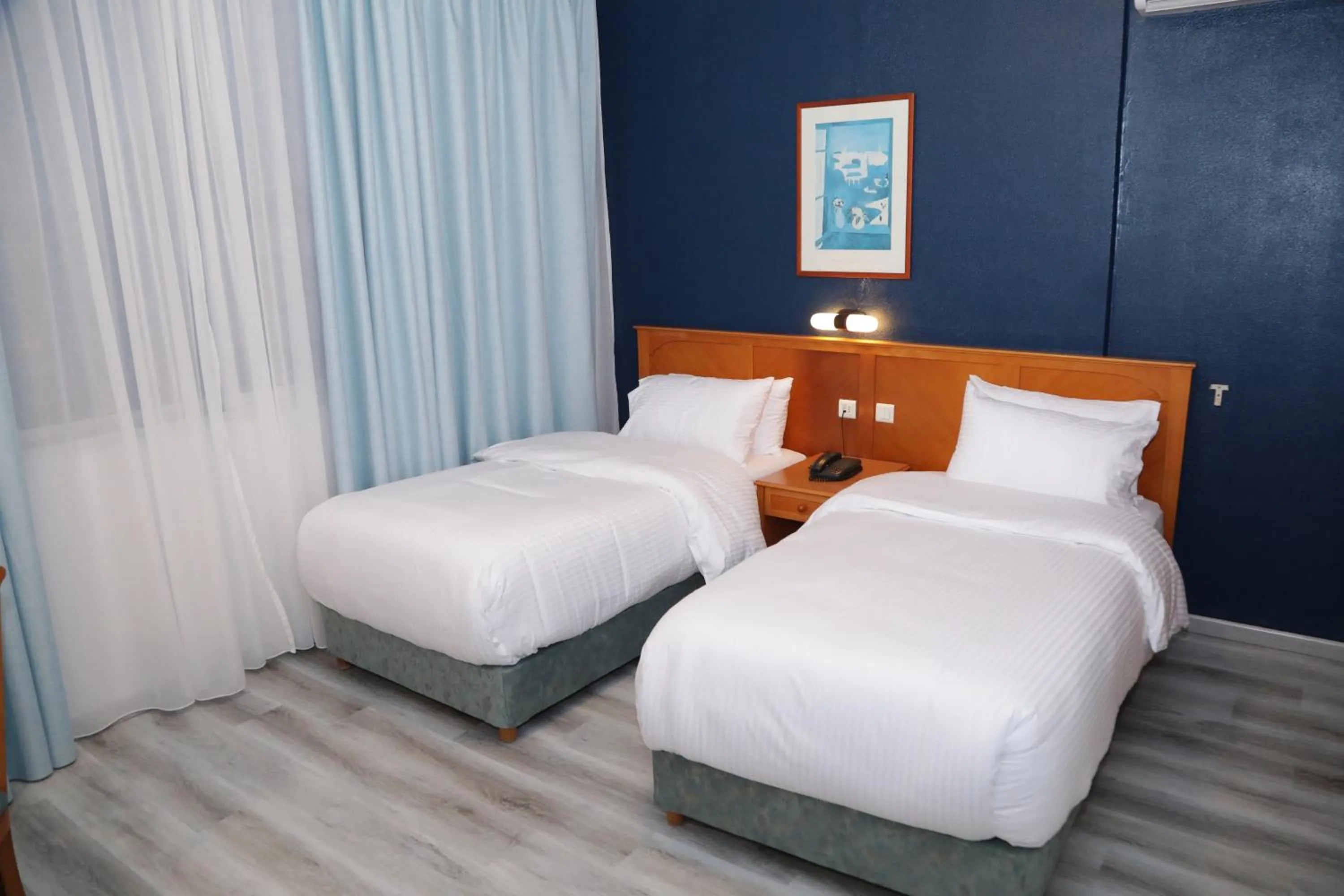 Bed in El Sheikh Suites Hotel