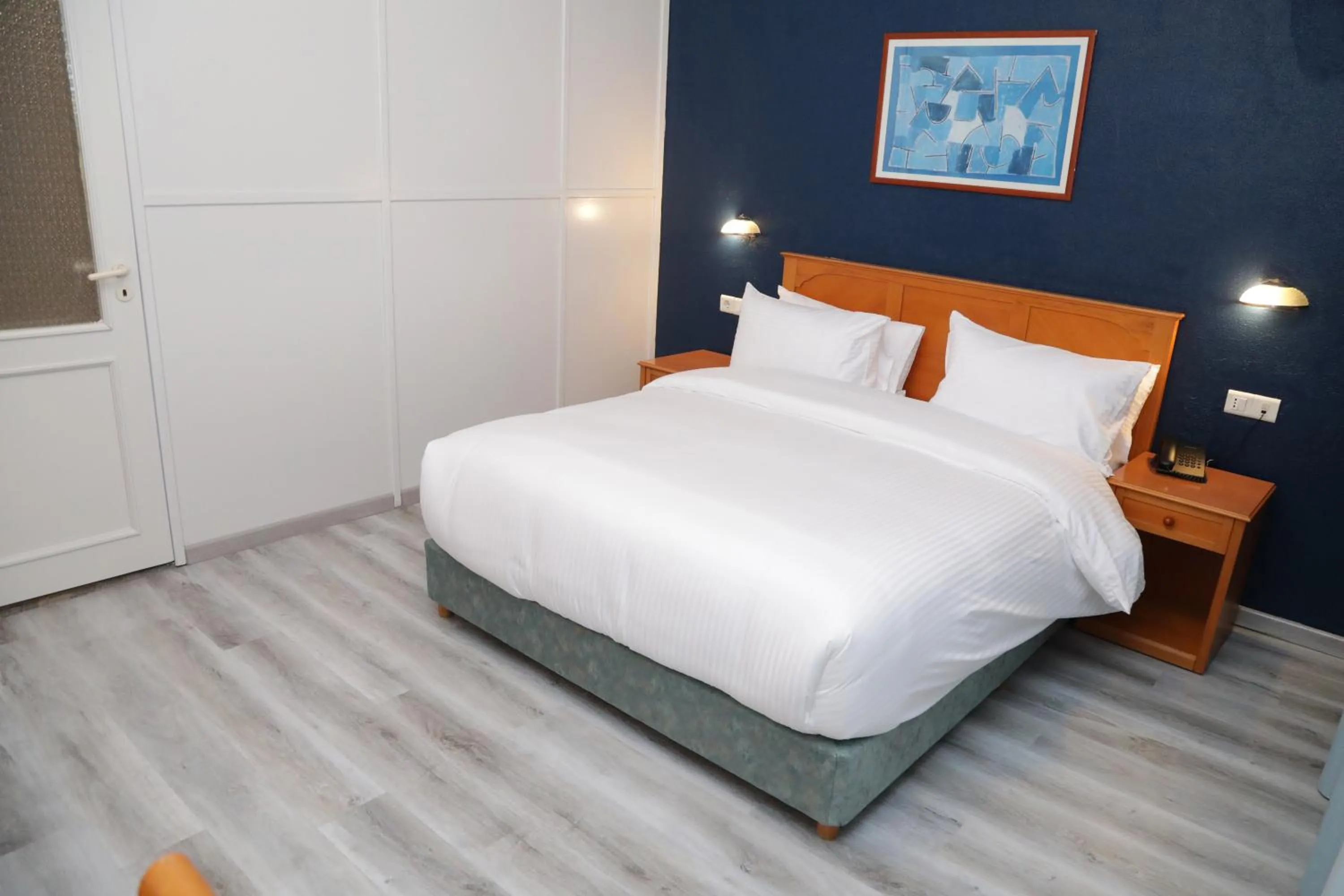 Bed in El Sheikh Suites Hotel