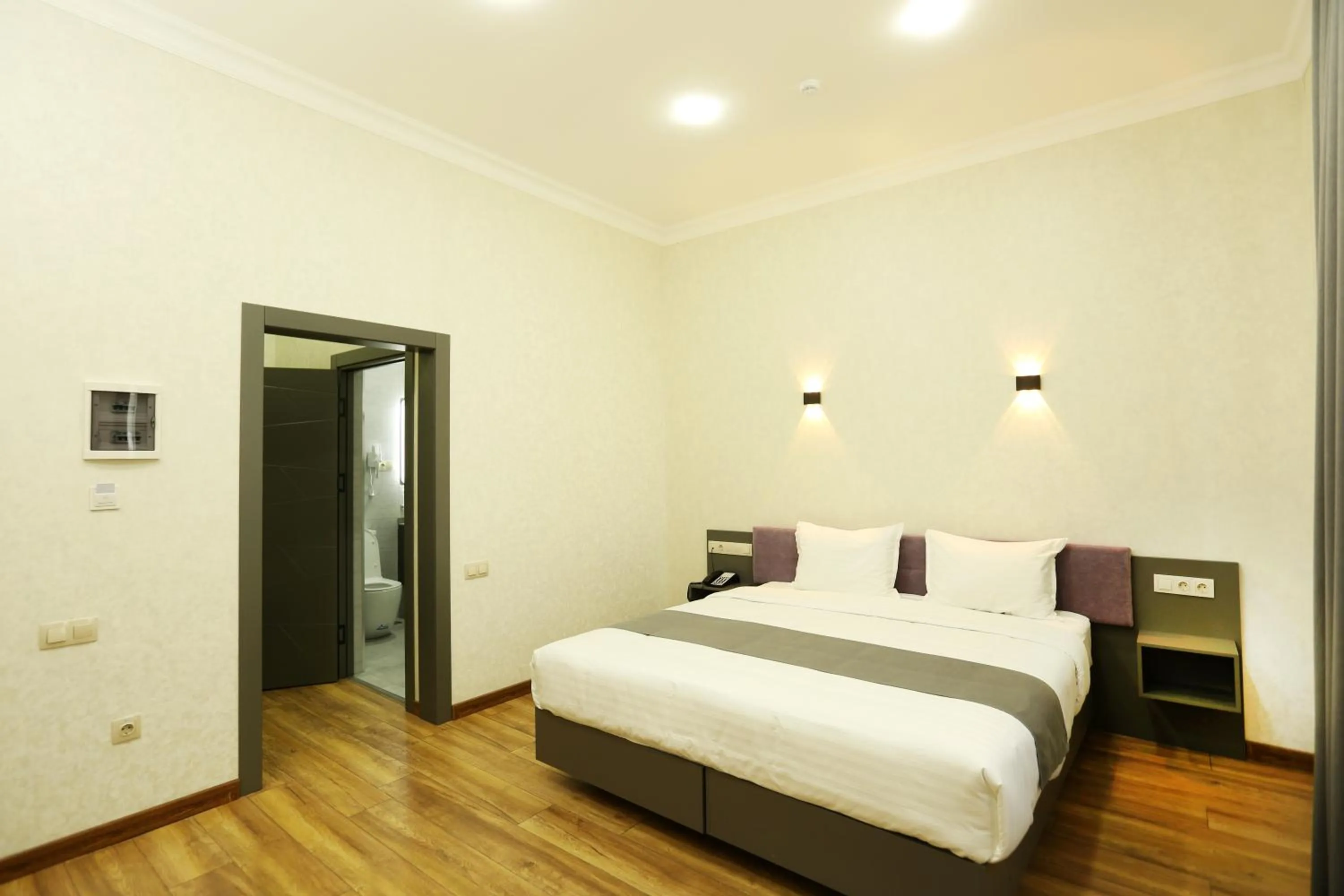 Bed in Parklane Hotel