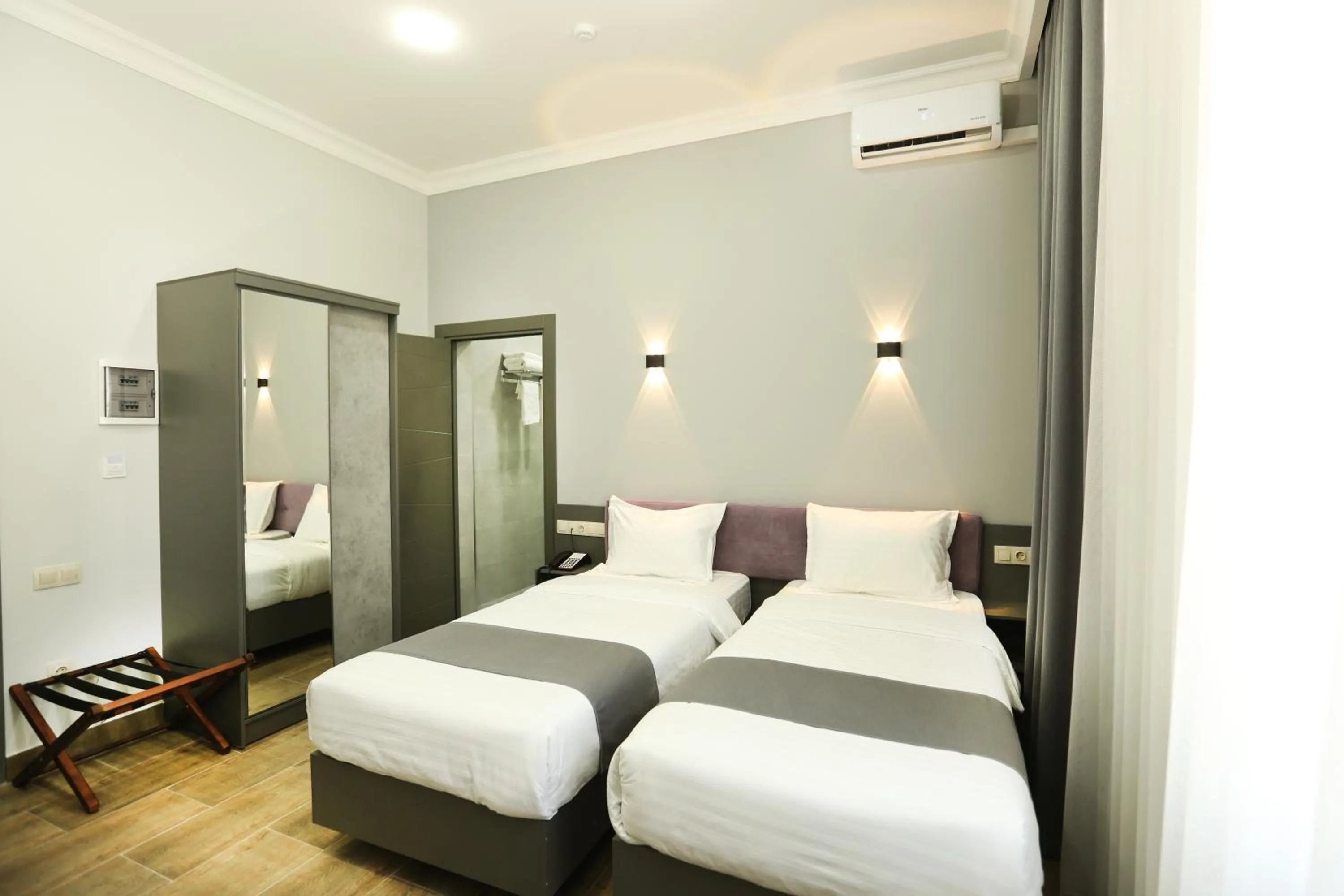 Bed in Parklane Hotel