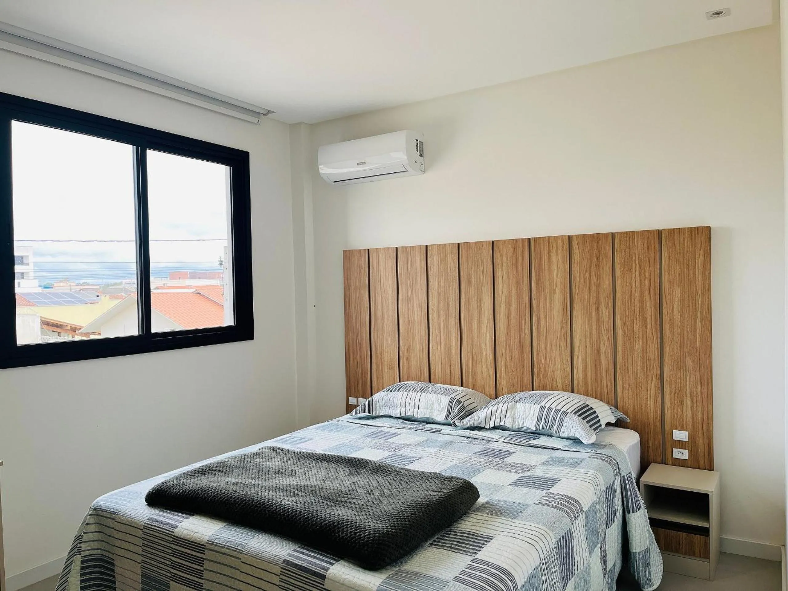 Photo of the whole room, Bed in Incrível apartamento à 200m da praia