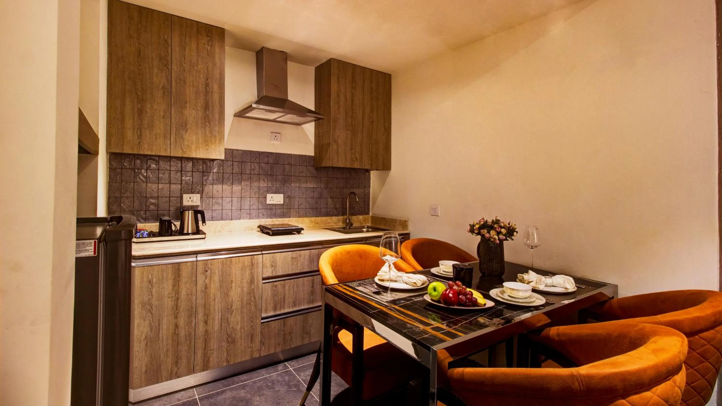 Kitchen or kitchenette in Rhythm Gurugram Hotel & Suites, Sohna Road