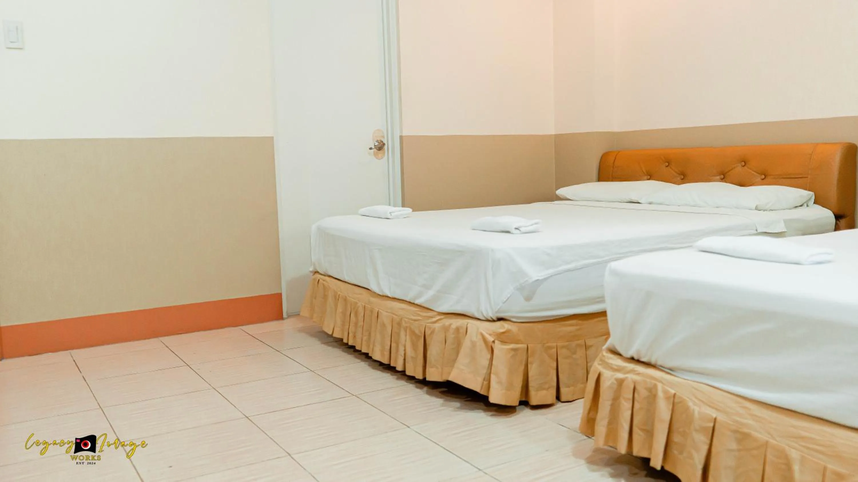 Bed in Imperial Ridge Pension House