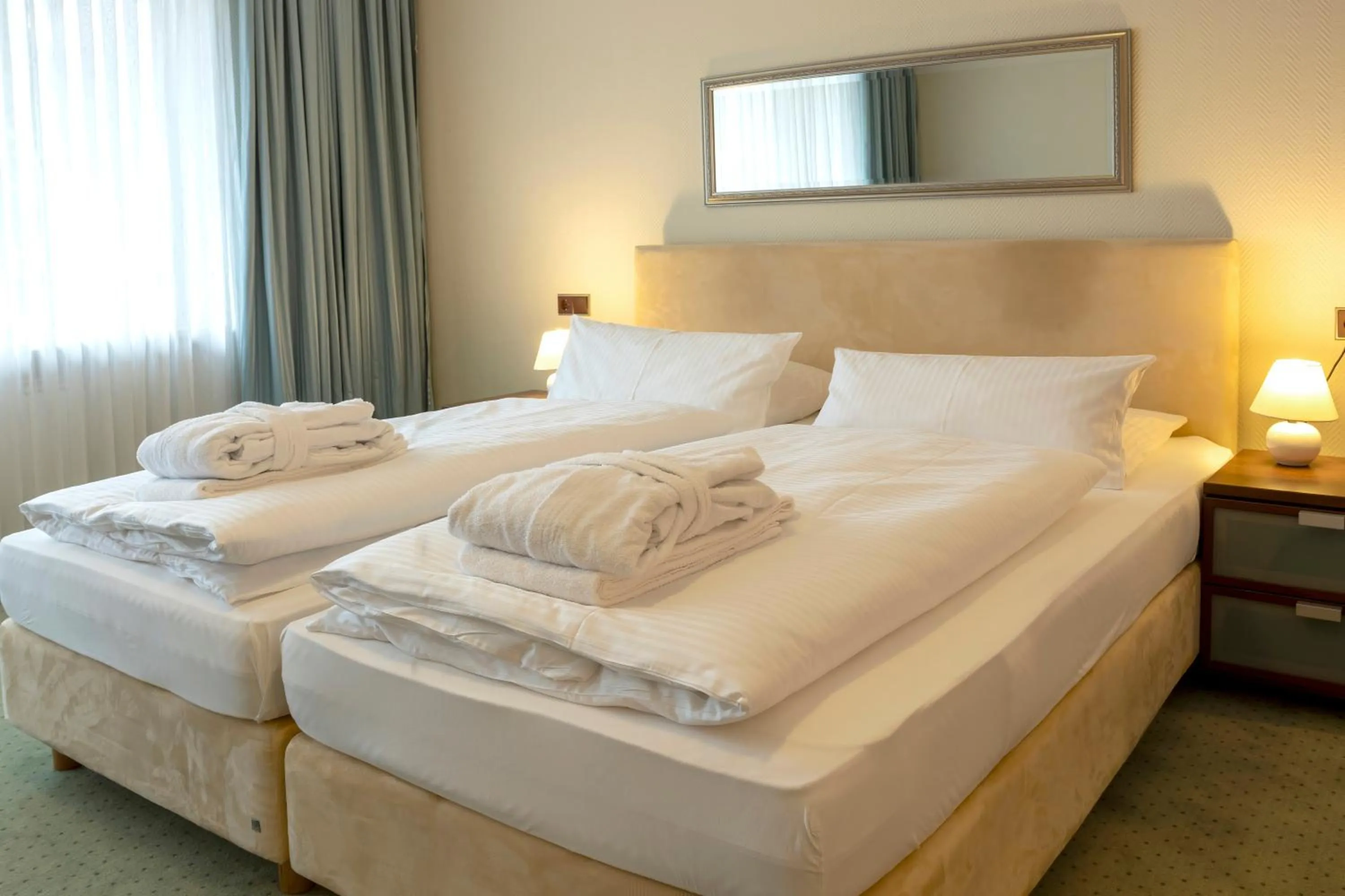 Photo of the whole room, Bed in Golf- und Wellnesshotel Amtsheide