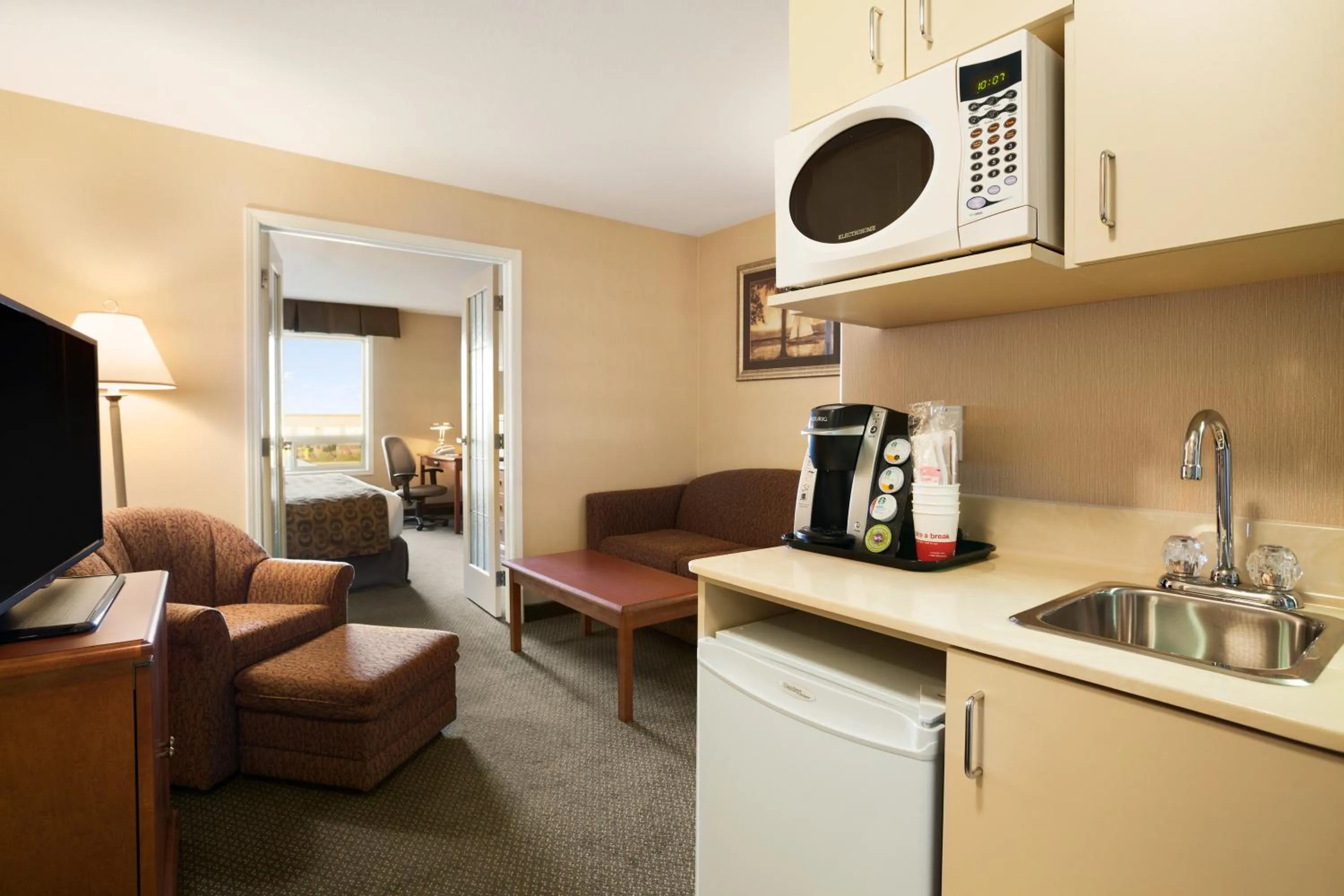 Living room in Ramada by Wyndham Clairmont/Grande Prairie