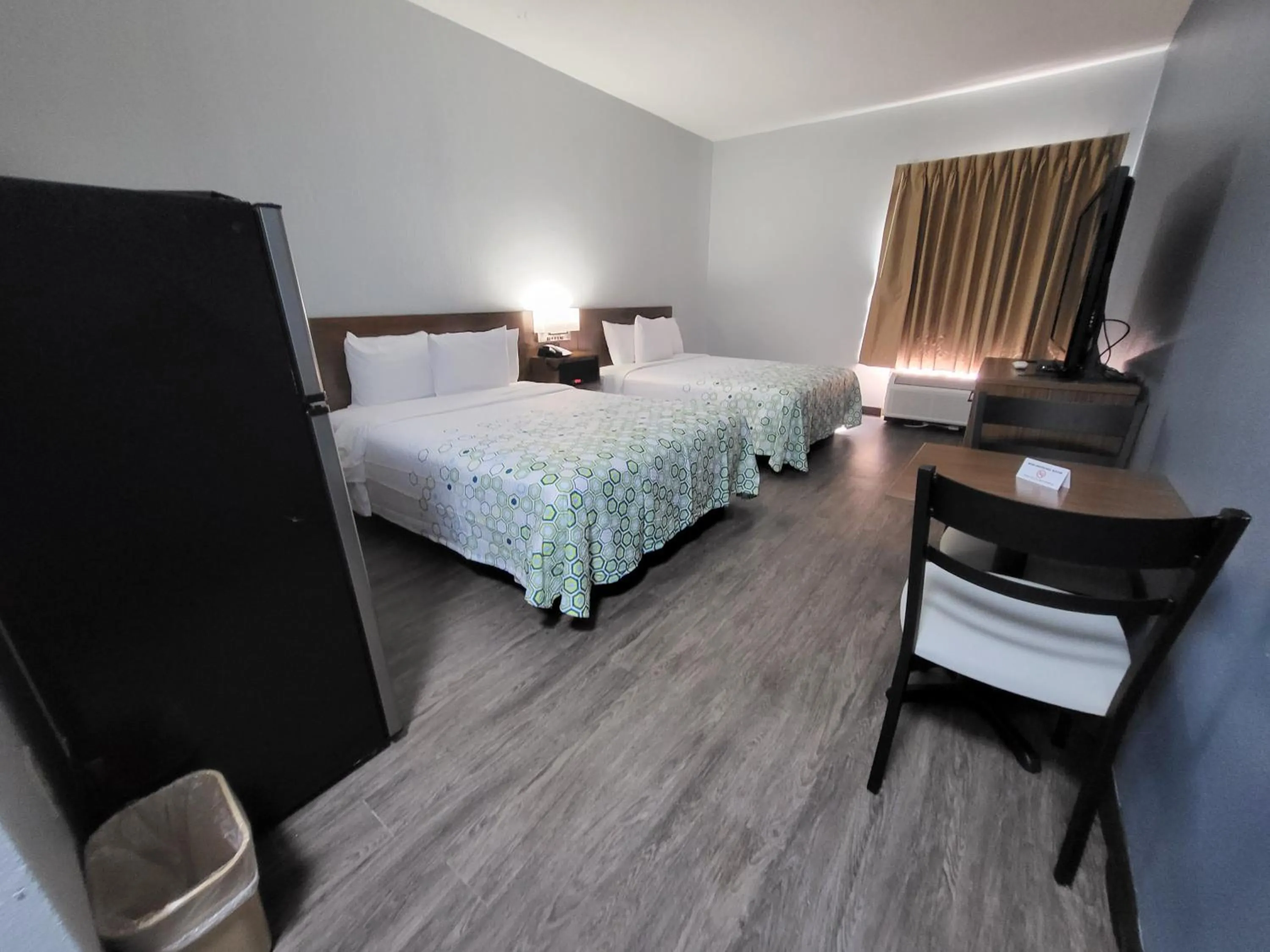 Bedroom, Bed in HomeTowne Studios by Red Roof Prattville