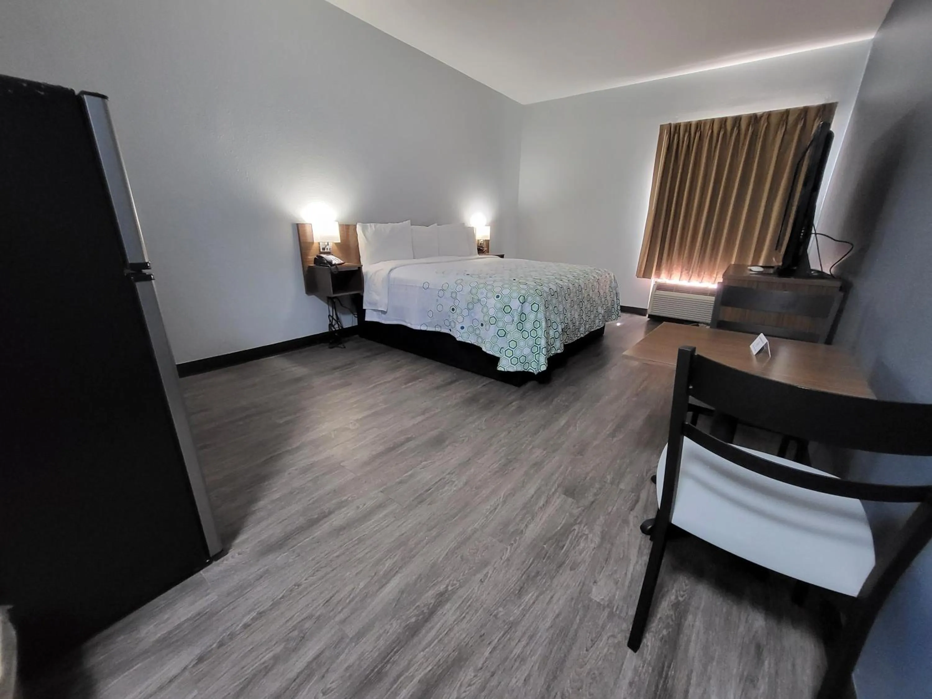 Bedroom, Bed in HomeTowne Studios by Red Roof Prattville