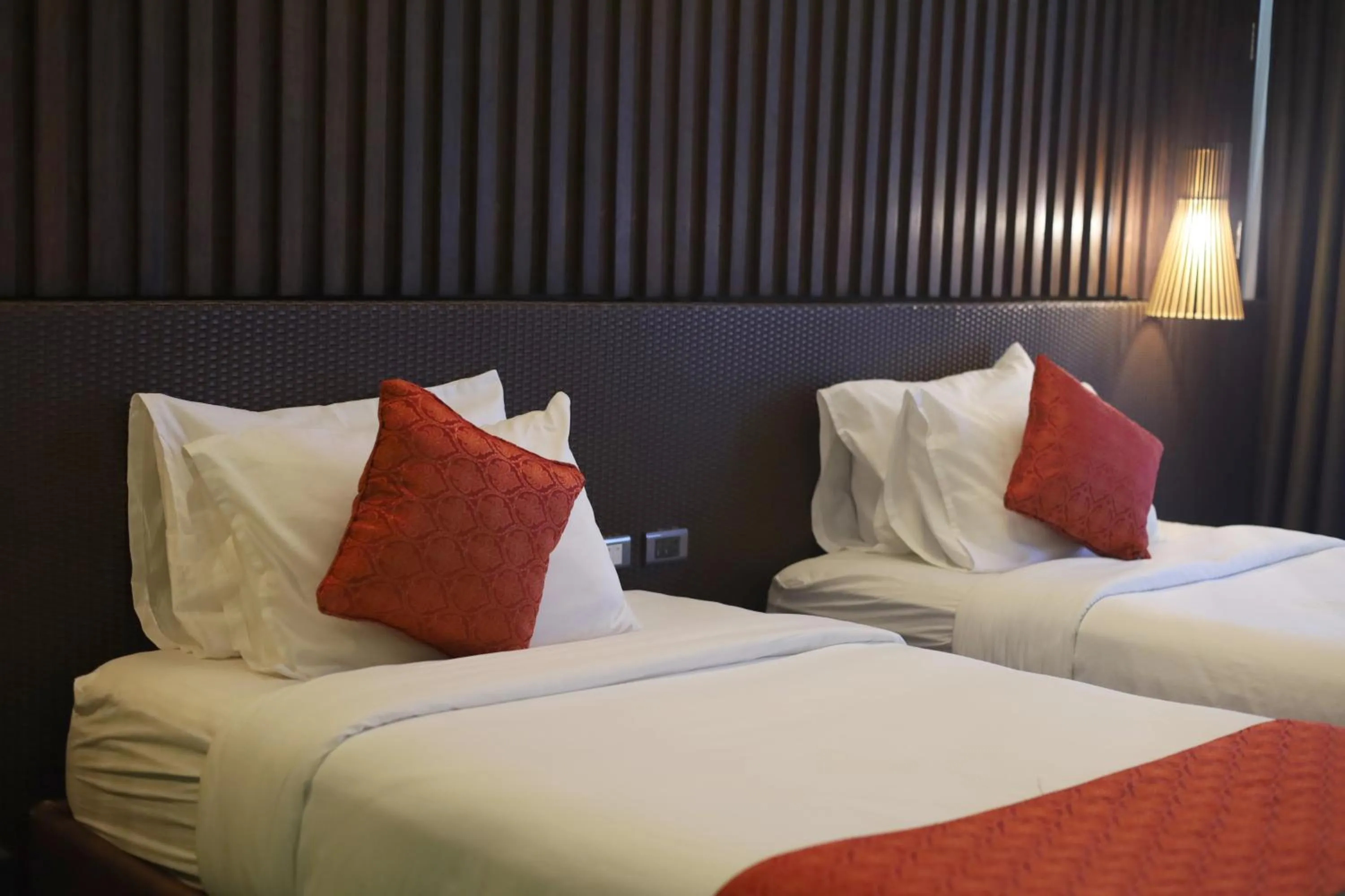 Bed in Orange Pearl Beach Resort