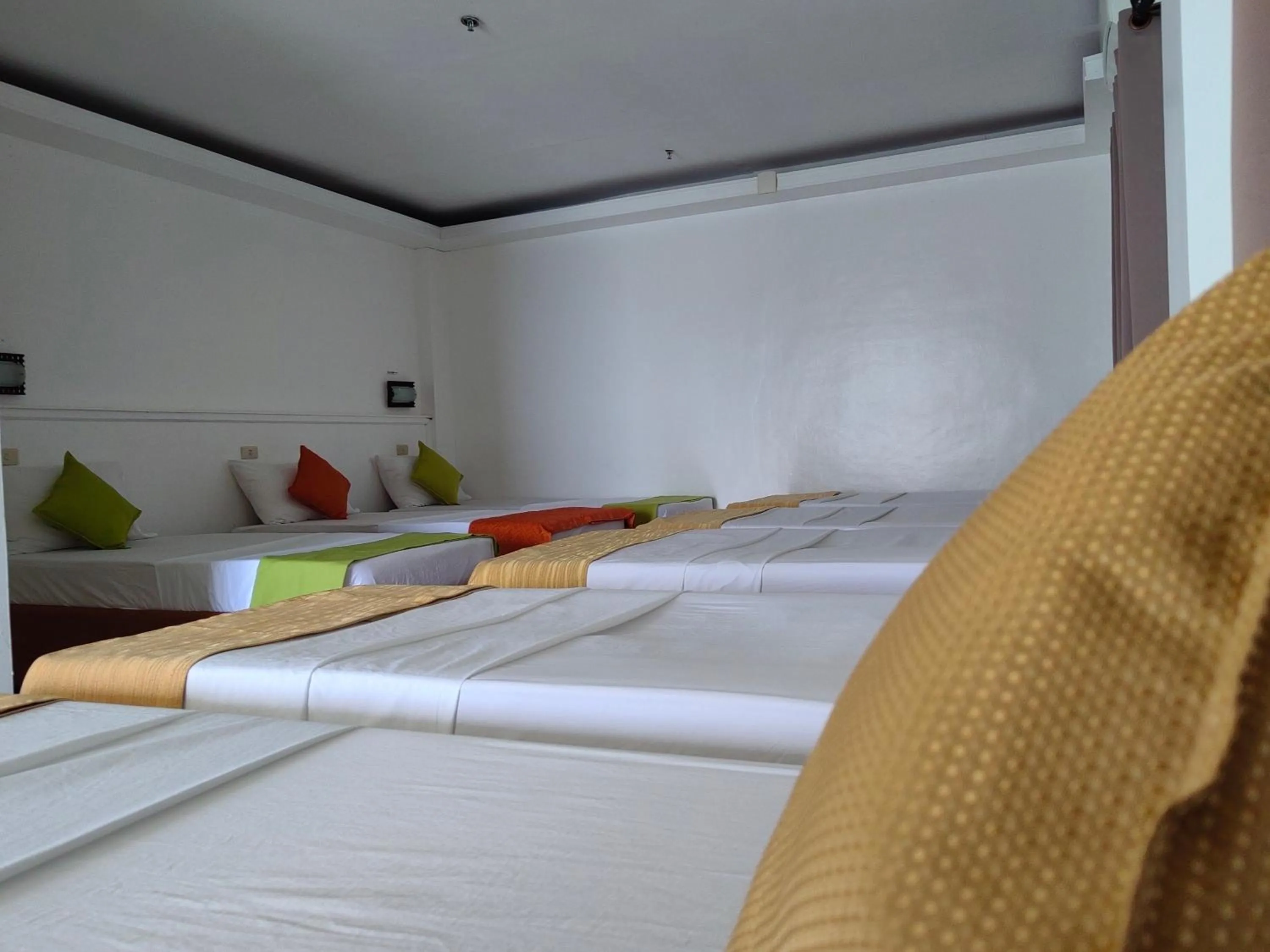 Bed in Orange Pearl Beach Resort