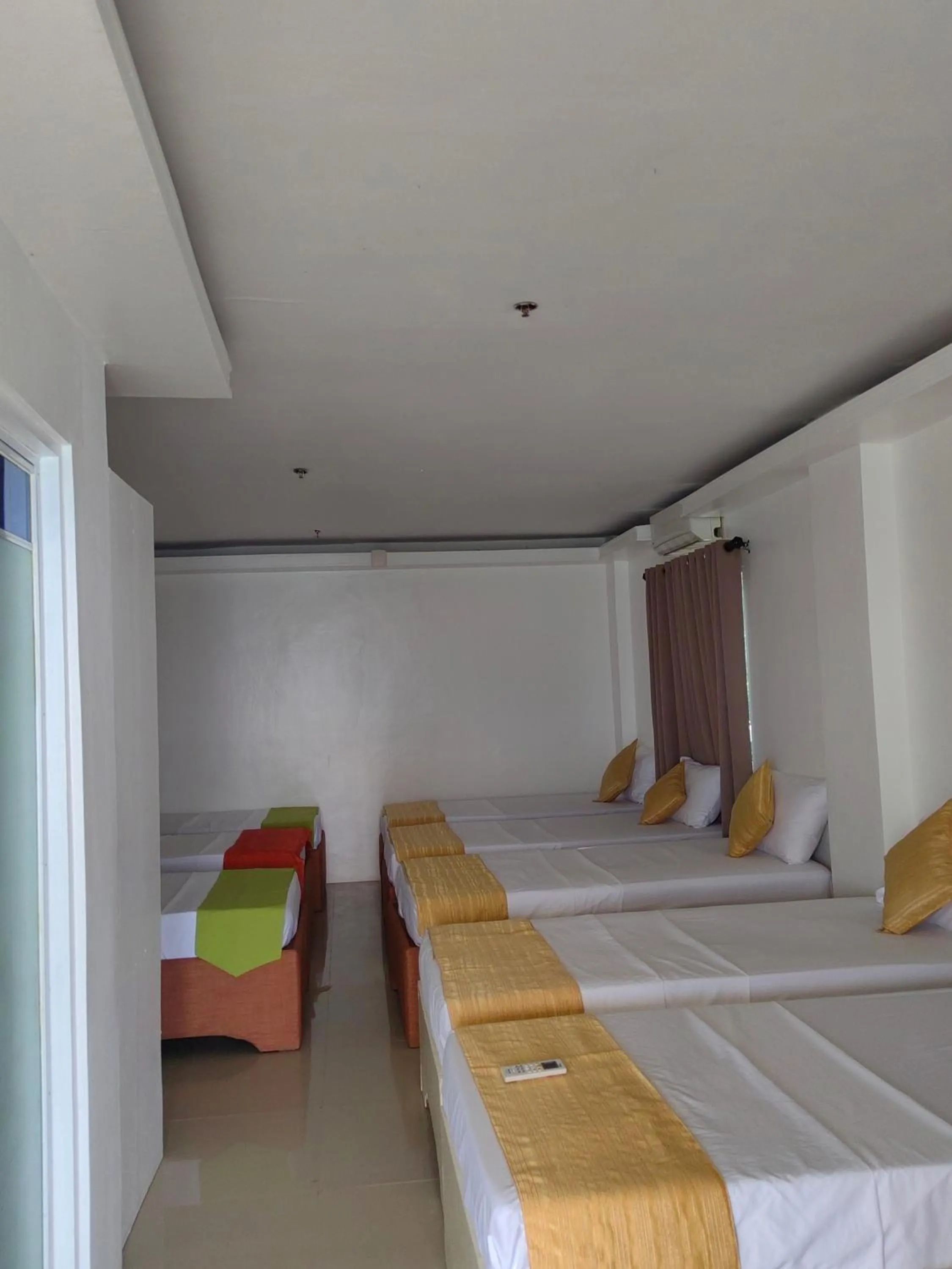 Bed in Orange Pearl Beach Resort