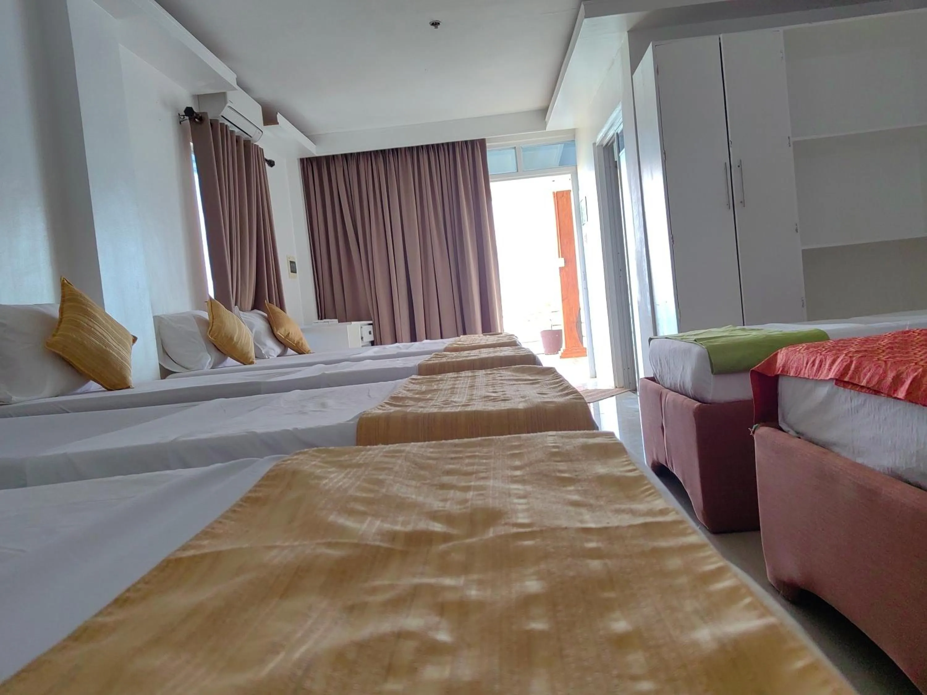 Bed in Orange Pearl Beach Resort