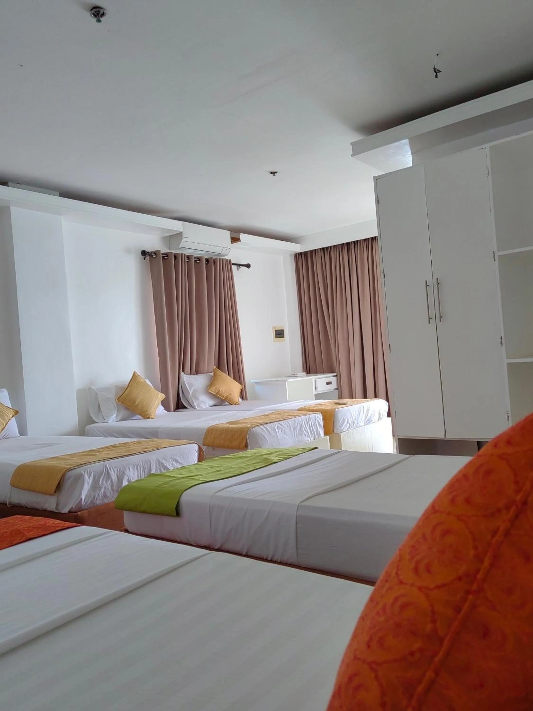 Bed in Orange Pearl Beach Resort