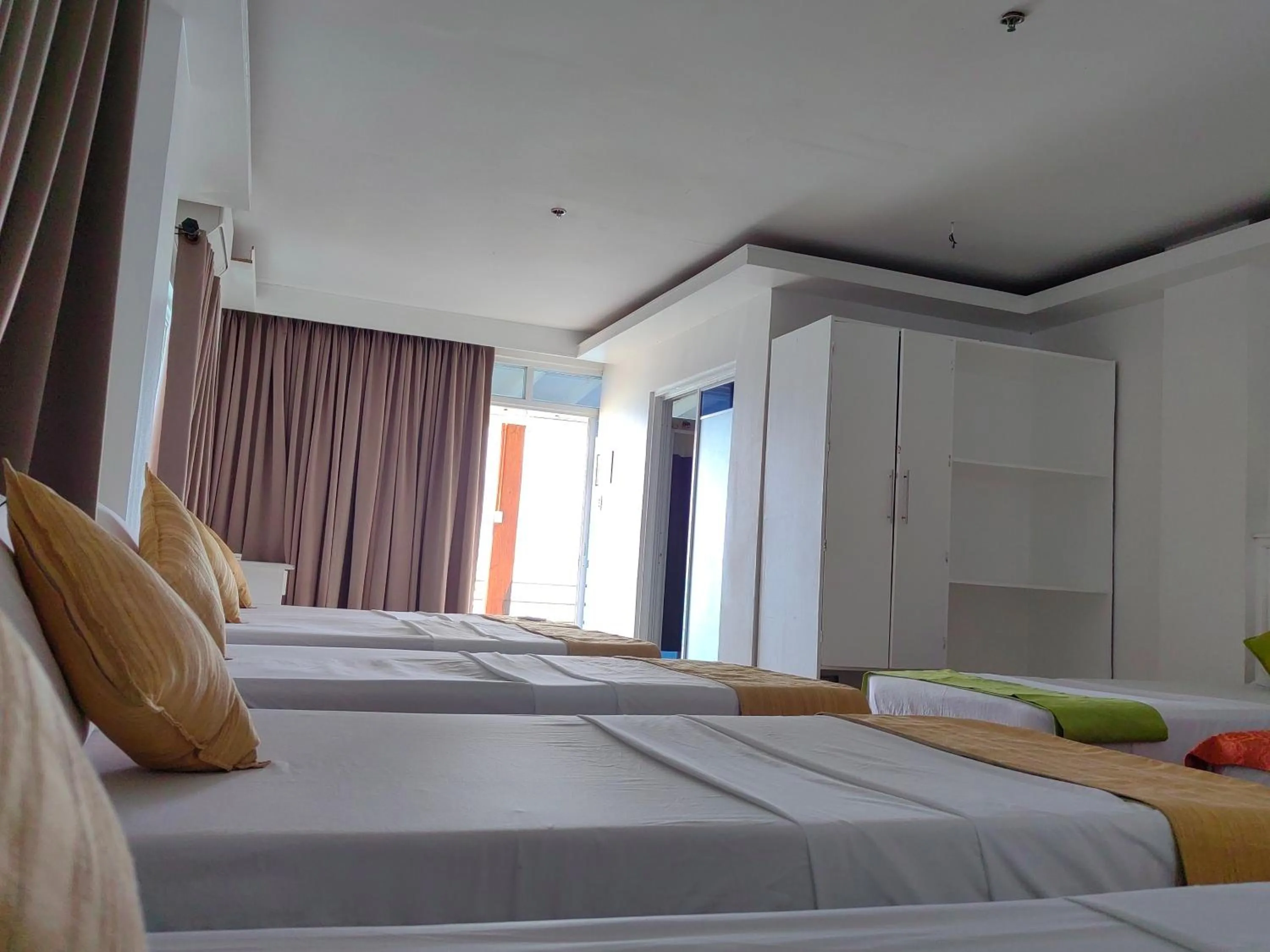 Bed in Orange Pearl Beach Resort