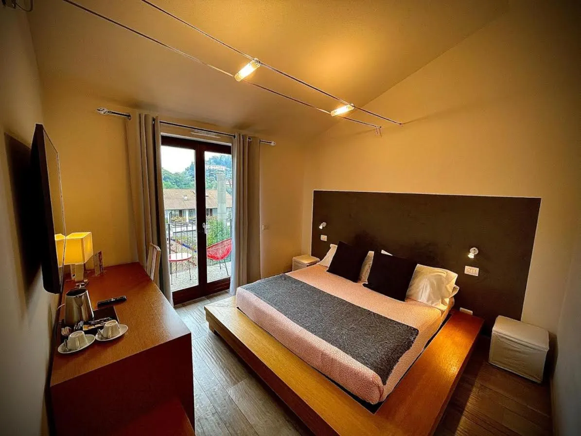 Bed in Charming Bellagio Boutique Hotel