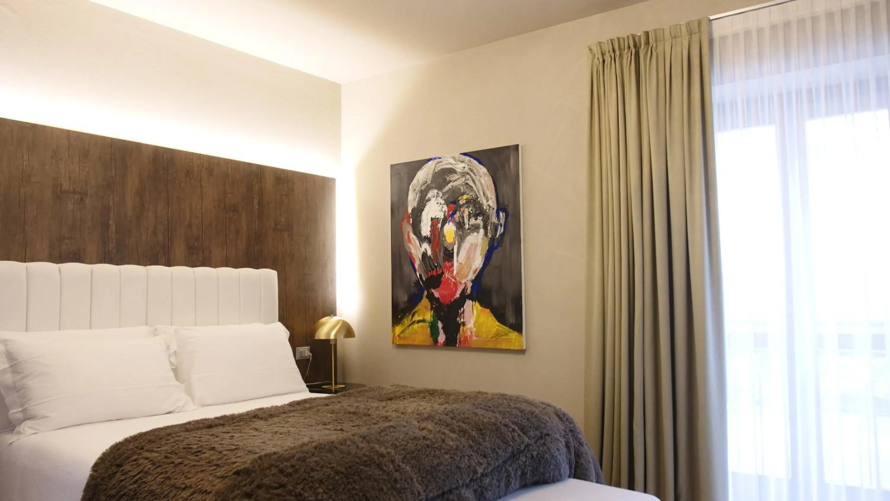 Decorative detail, Bed in Hotel Battisti 31