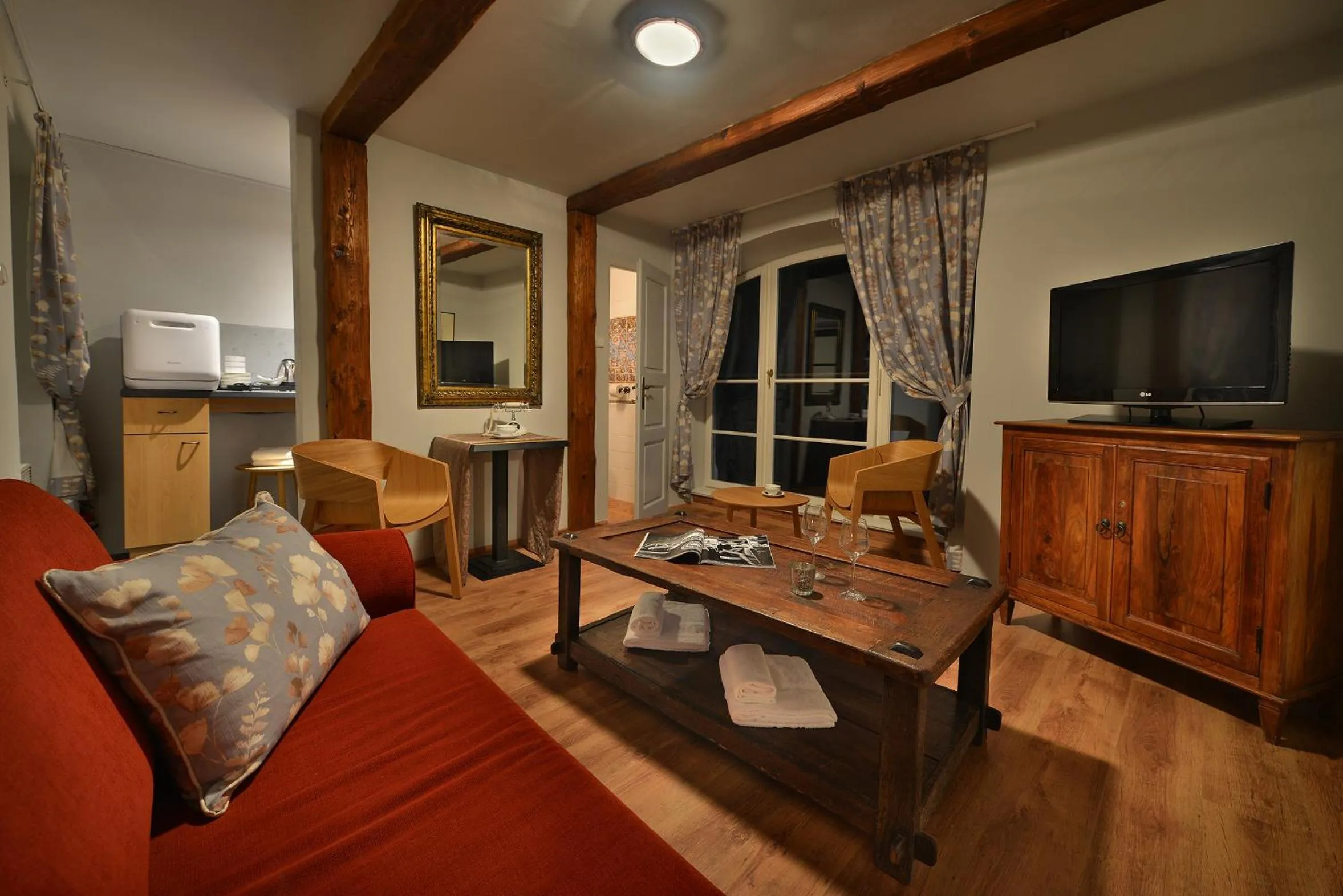 Communal lounge/ TV room in Chateau Loucen Garden Retreat