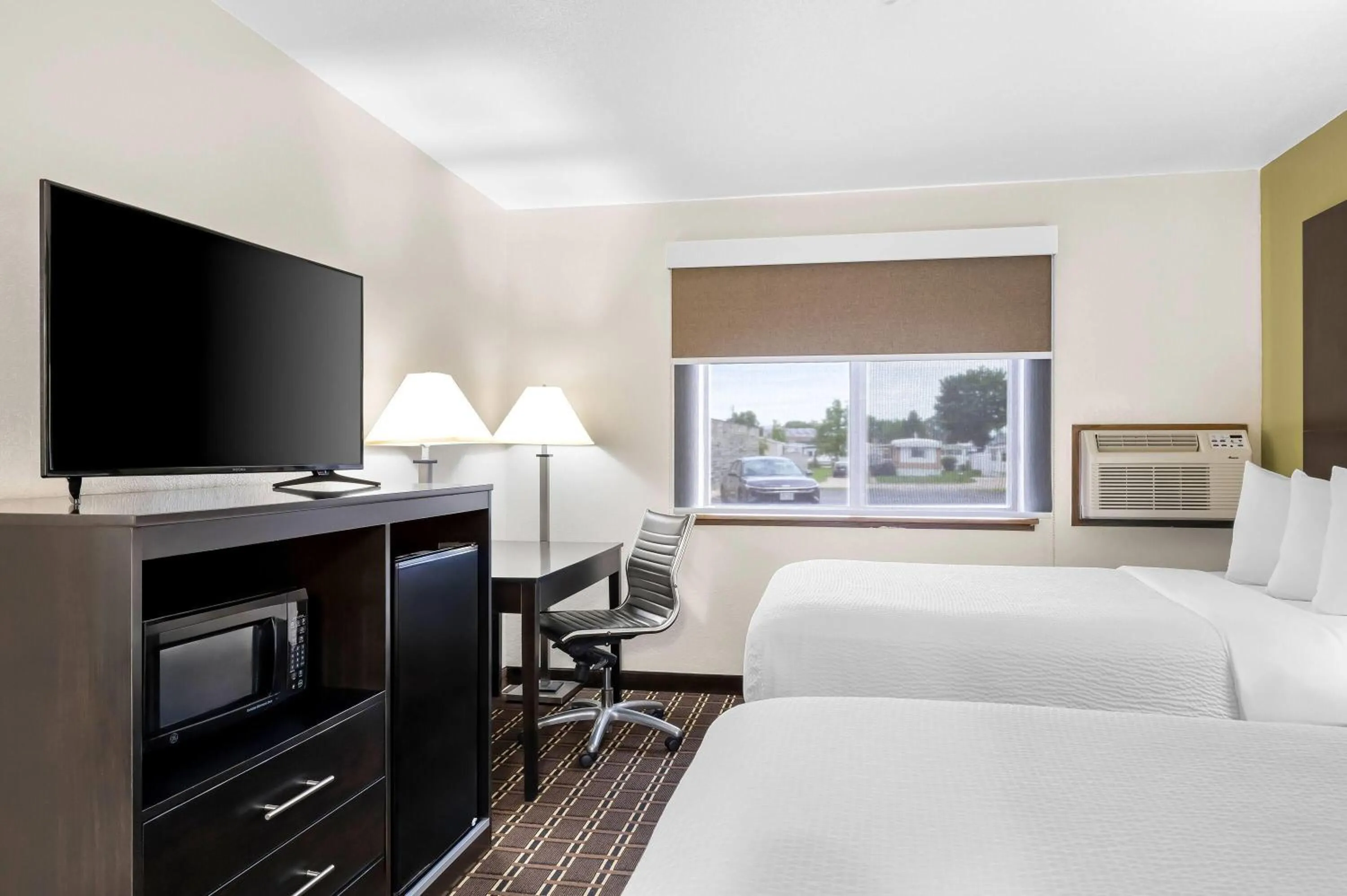 Bed in Super 8 by Wyndham La Crosse