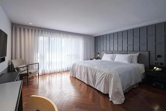 Bed in Red Dot Hotel