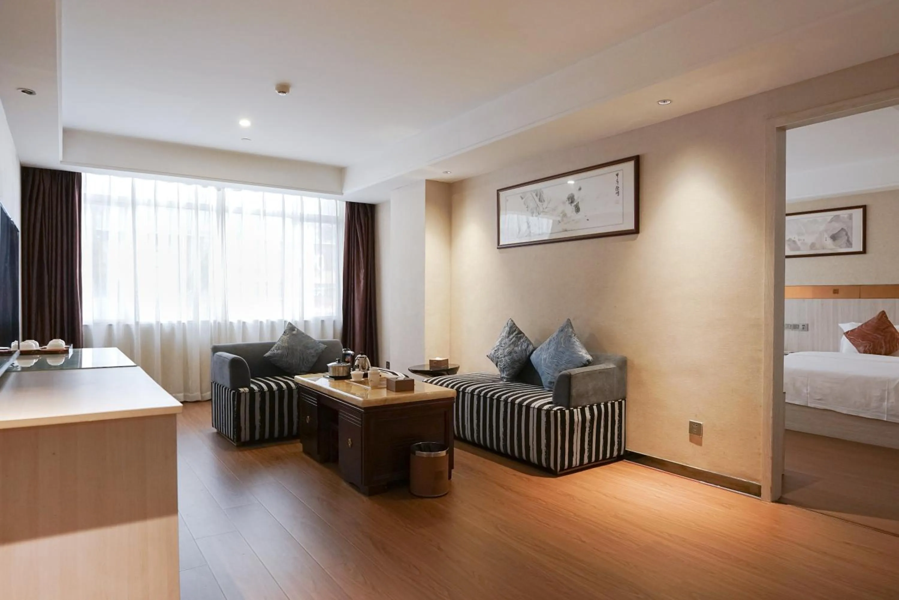 Living room, Bed in Paco Hotel Tianhe Coach Terminal Metro Satation Guangzhou-Free Shuttle Bus for Canton Fair