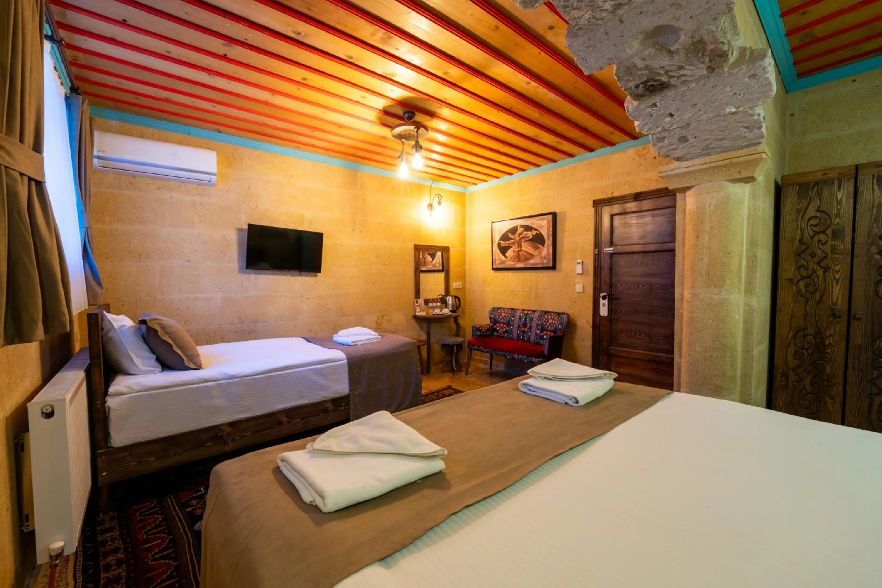 Photo of the whole room, Bed in Rustic Caves