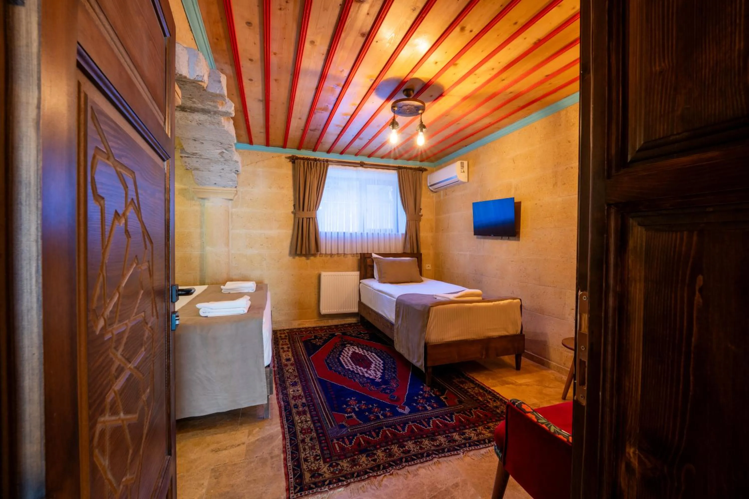 Photo of the whole room, Bed in Rustic Caves