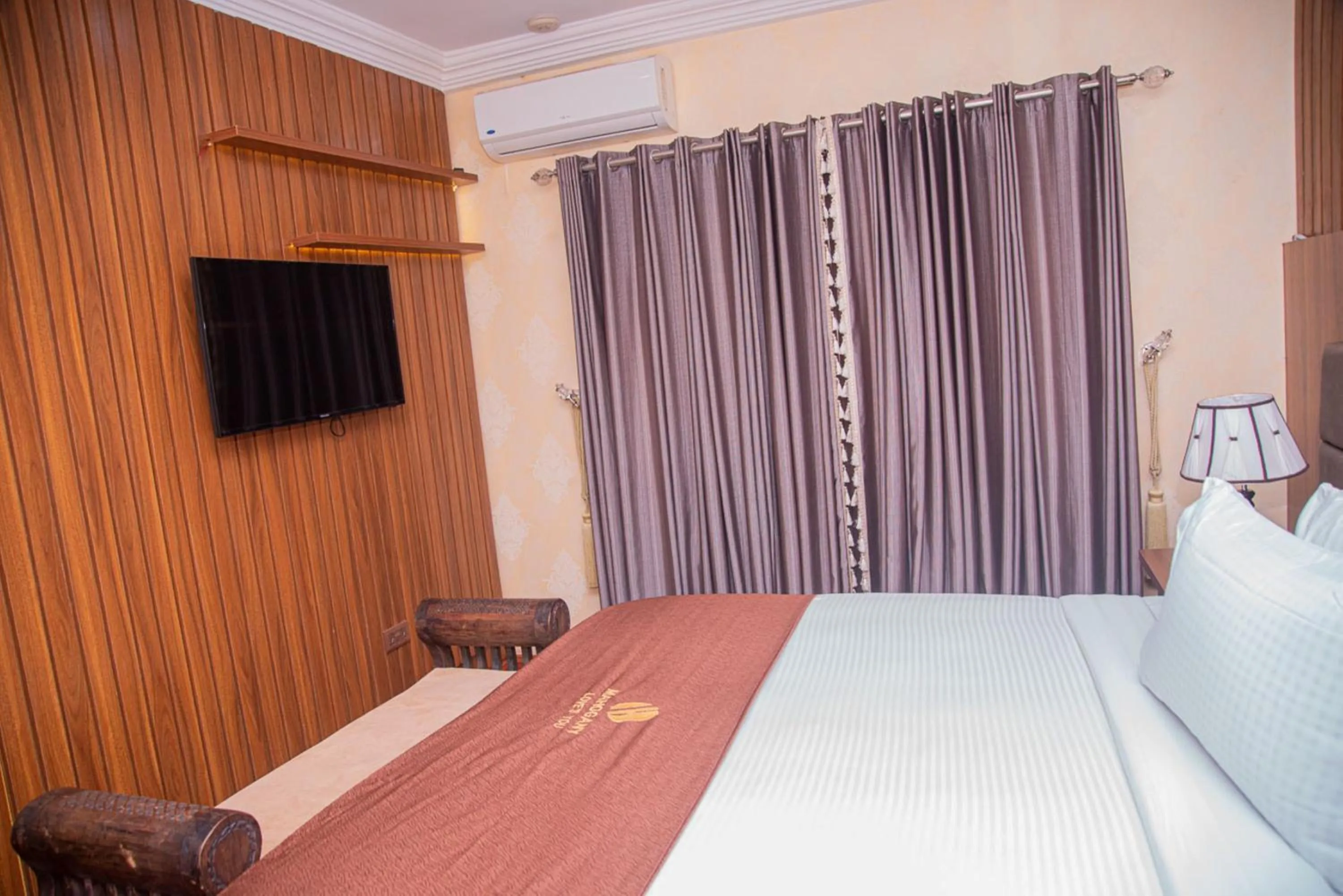 Bedroom in MAHOGANY HOTEL AND SUITES