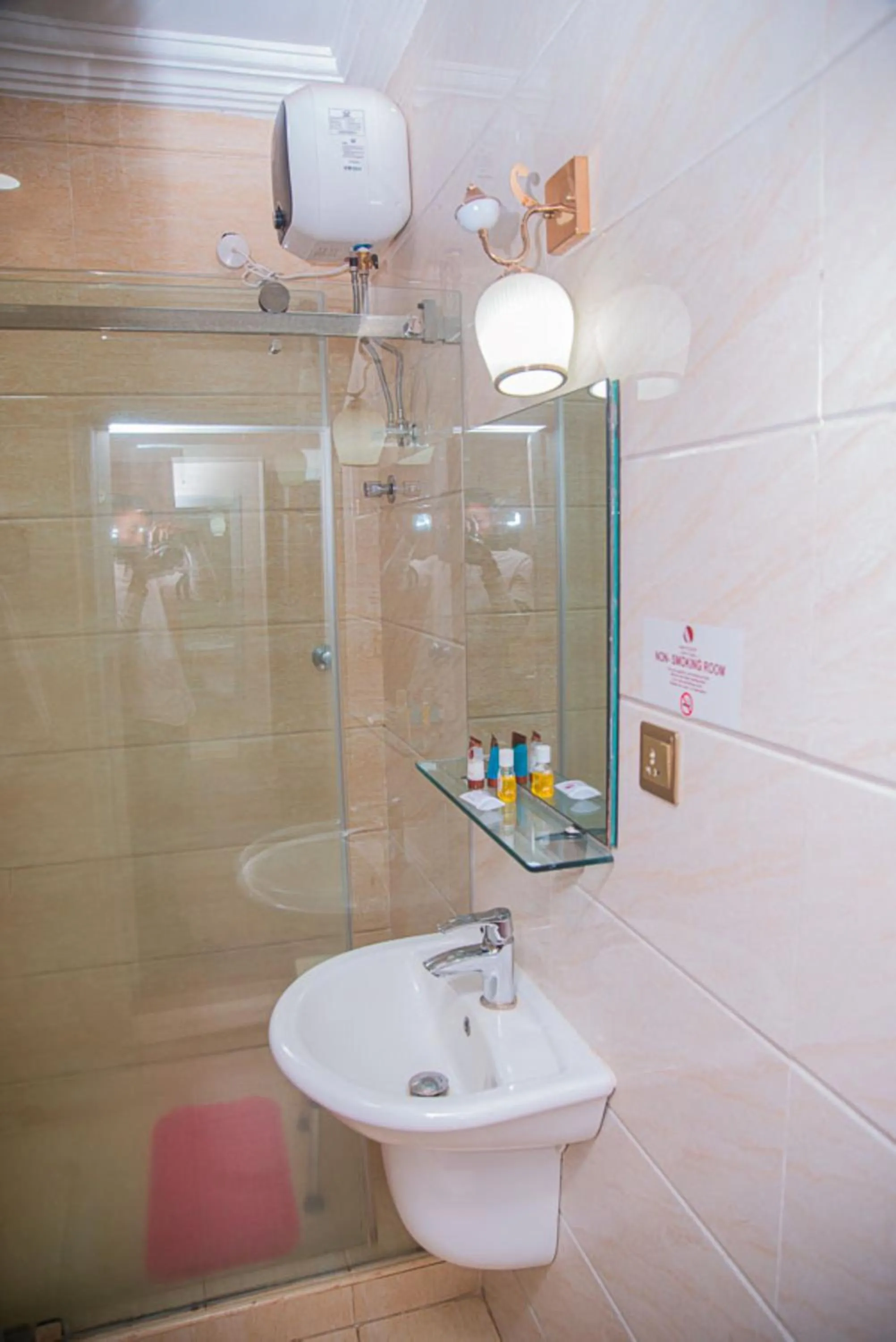 Toilet in MAHOGANY HOTEL AND SUITES