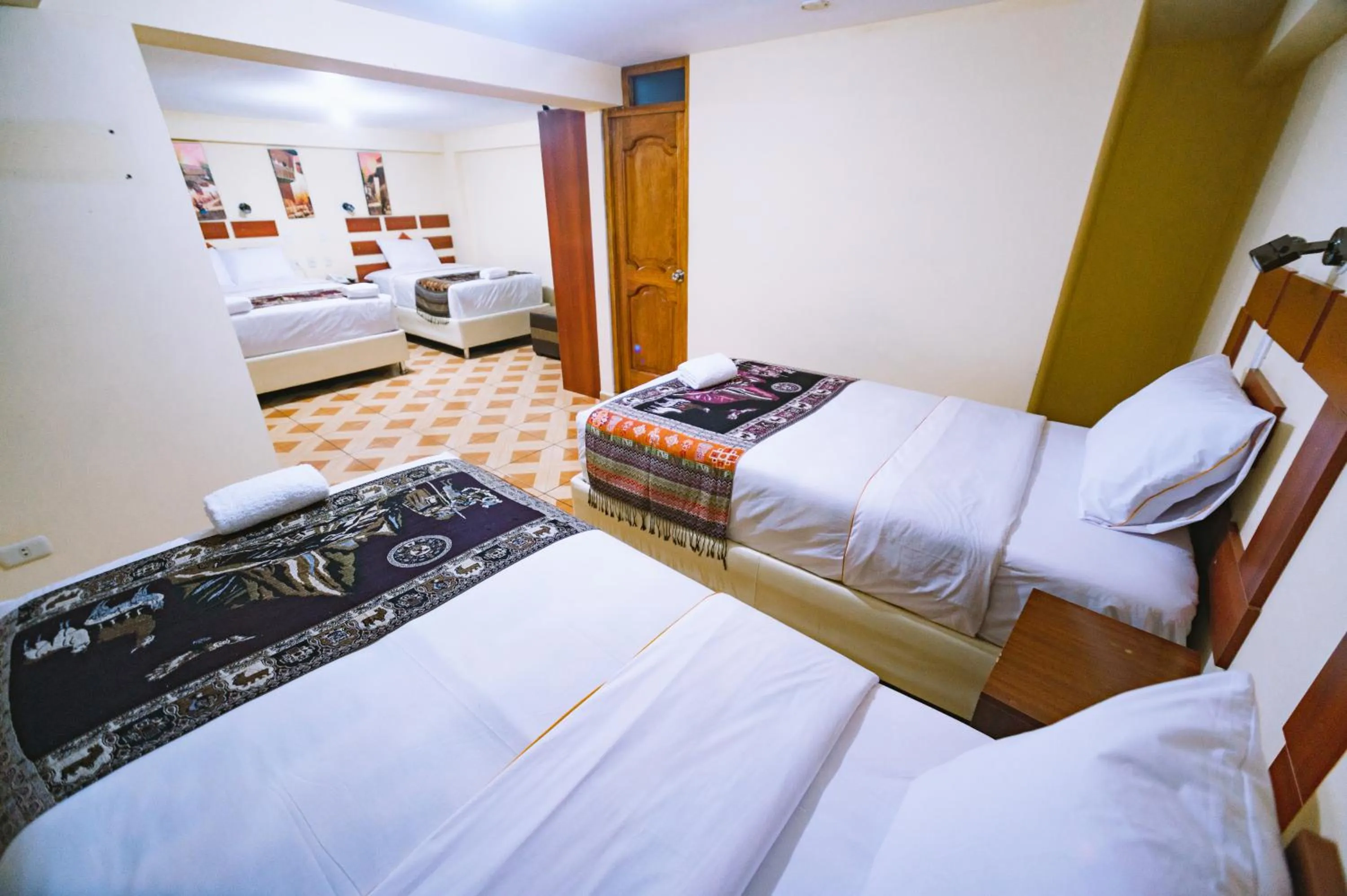 Bed in PAQARIQ INN HOTEL