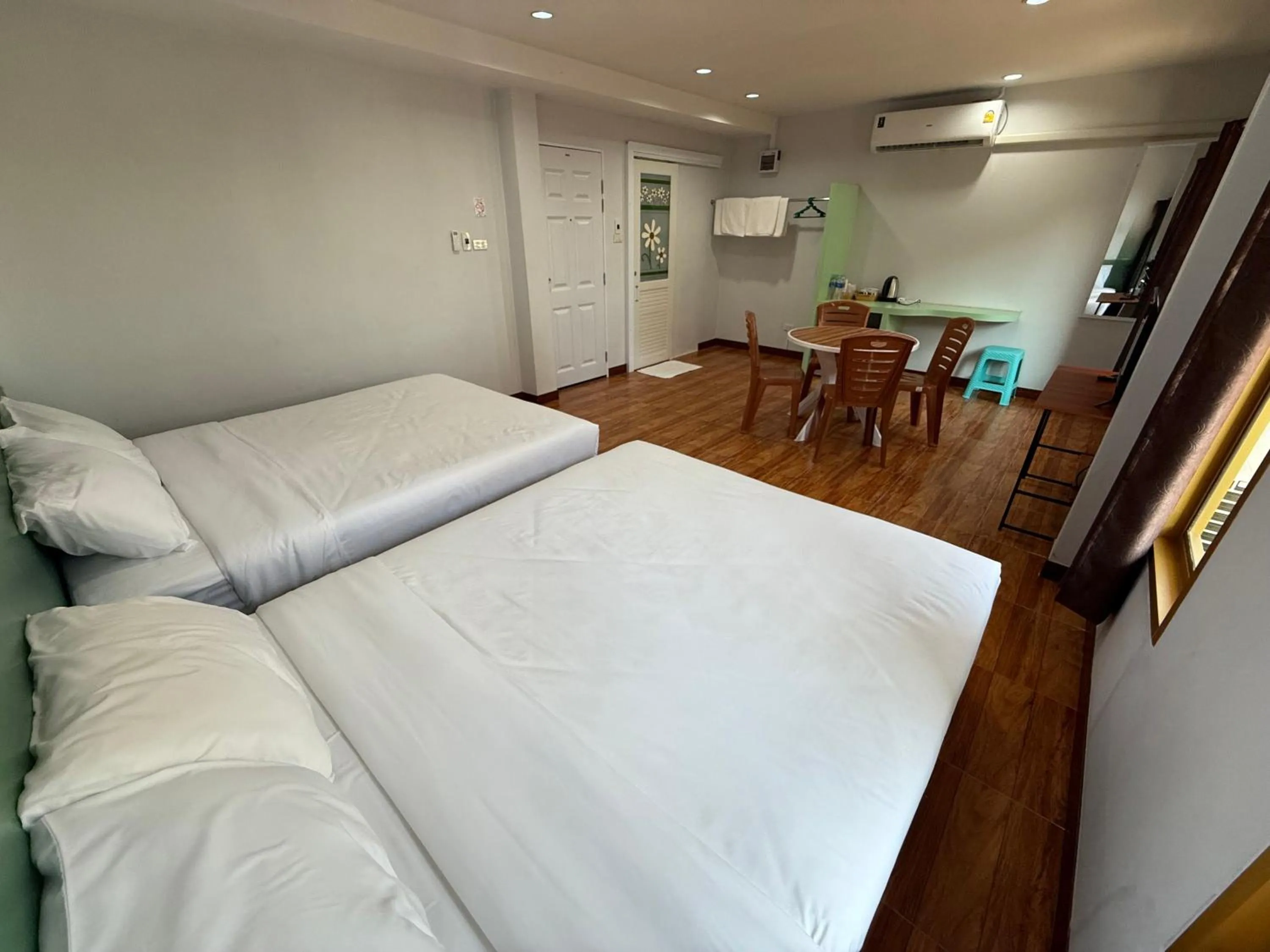 Bed in Chiang Kham Ruk Khun Hotel