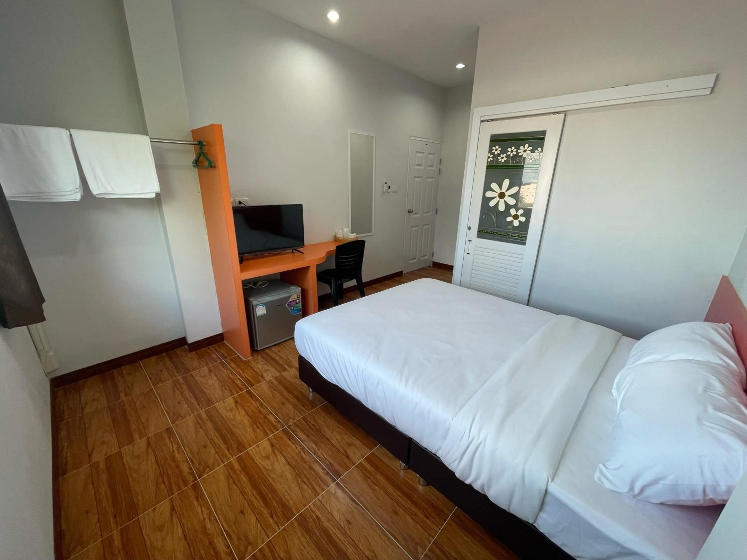 Bed in Chiang Kham Ruk Khun Hotel