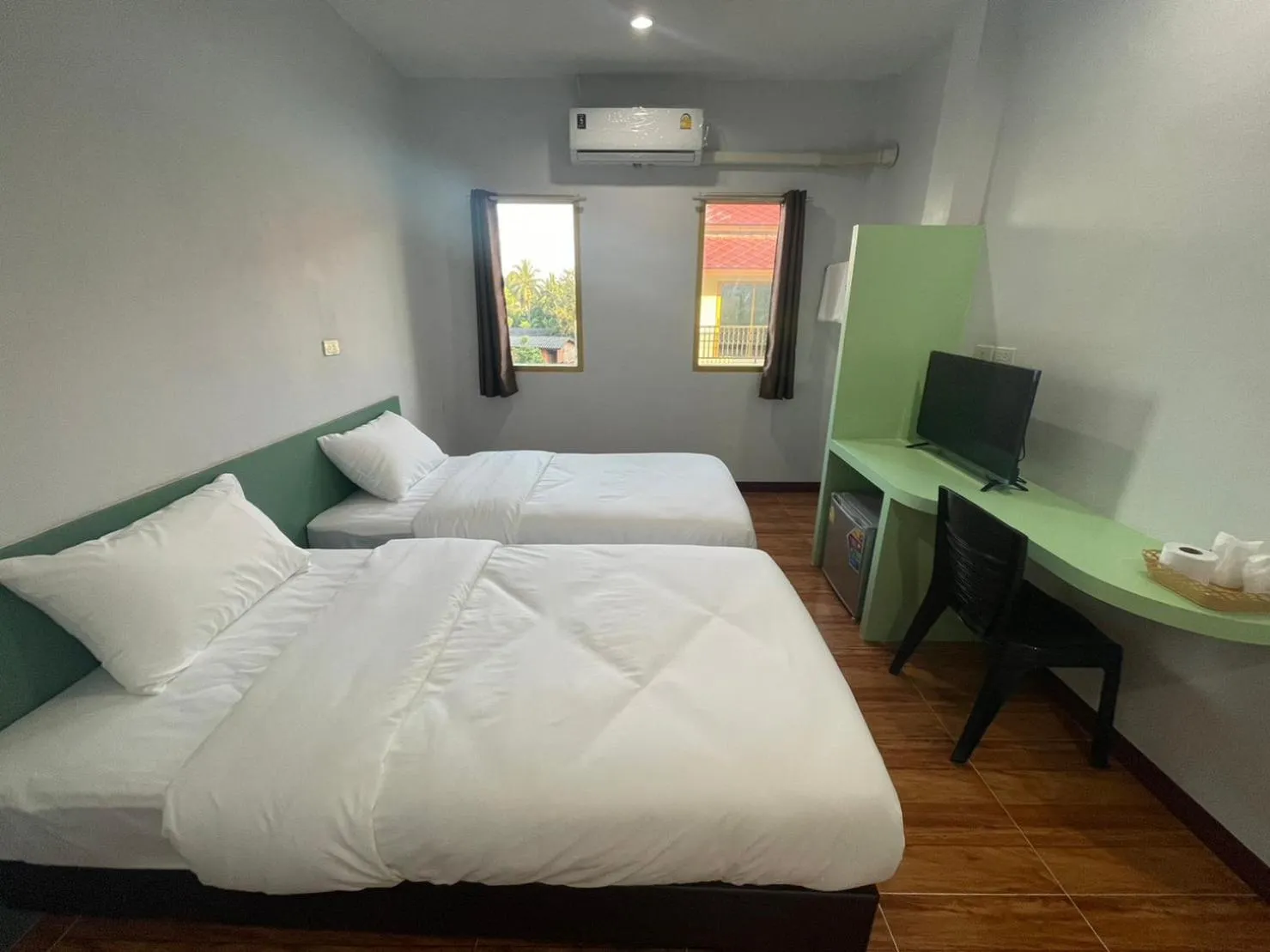 Bed in Chiang Kham Ruk Khun Hotel