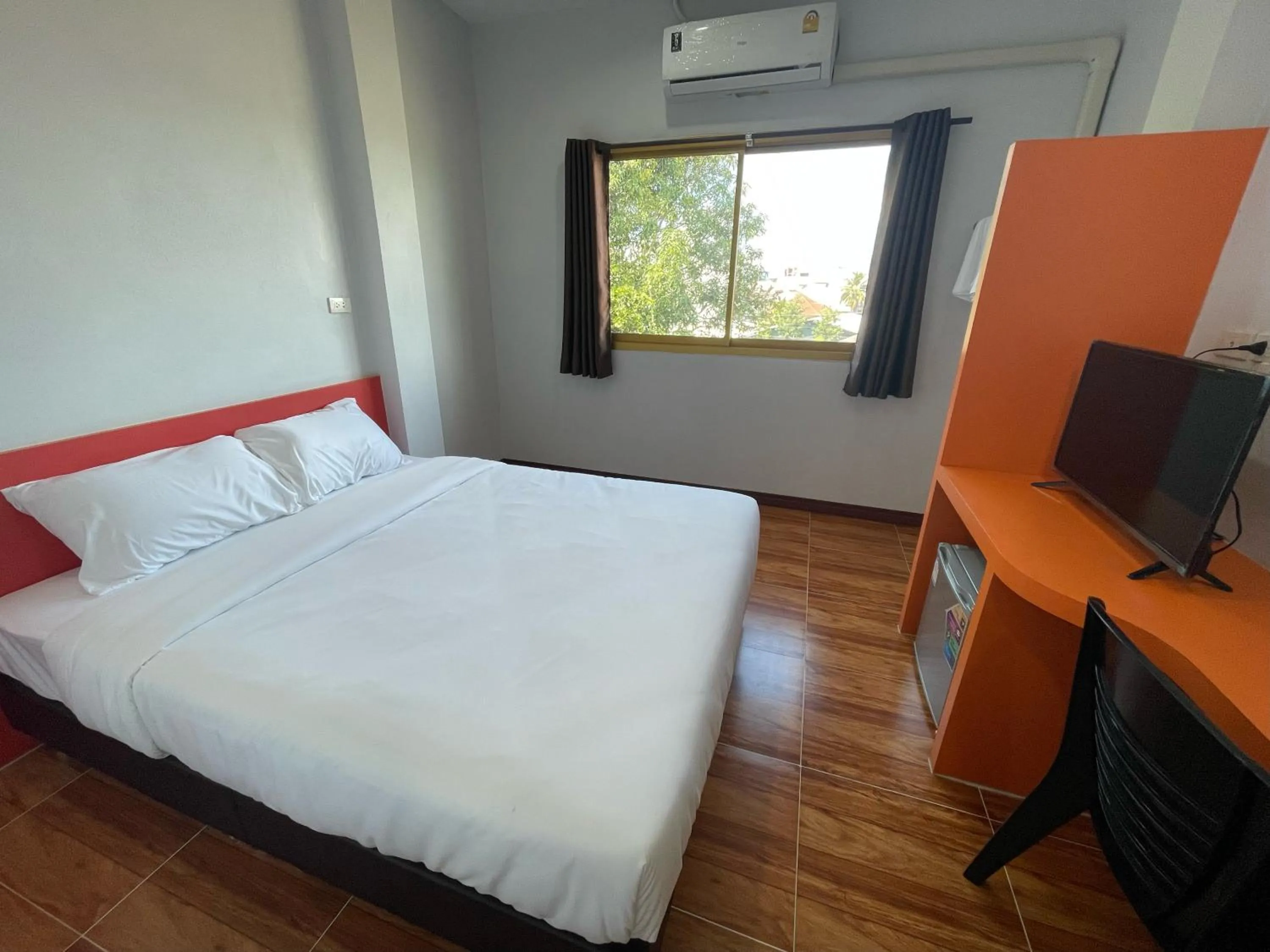 Bed in Chiang Kham Ruk Khun Hotel