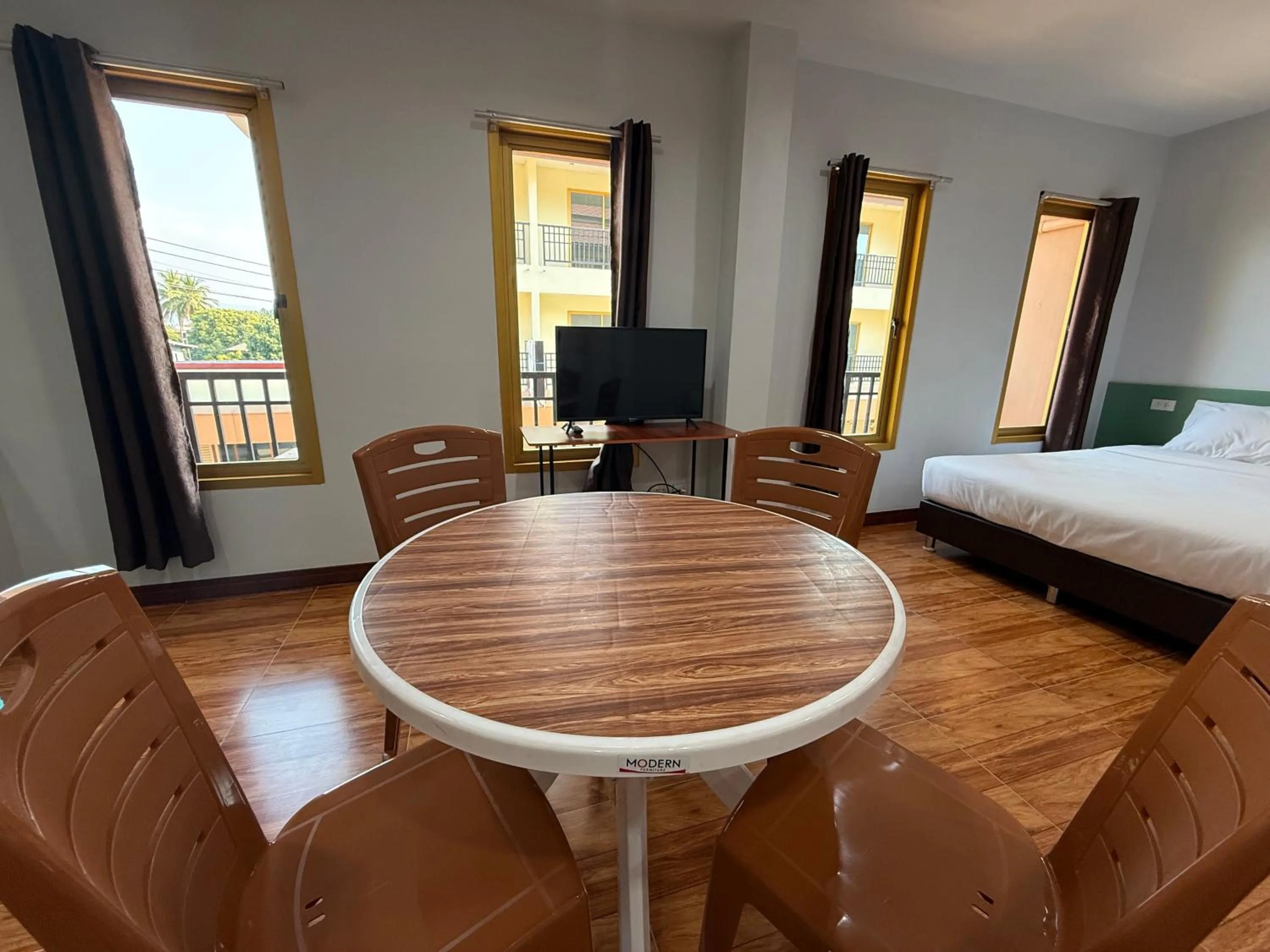 Bed in Chiang Kham Ruk Khun Hotel