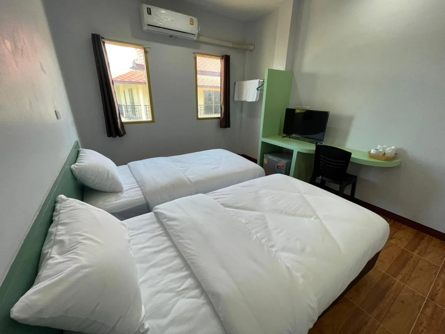 Bed in Chiang Kham Ruk Khun Hotel