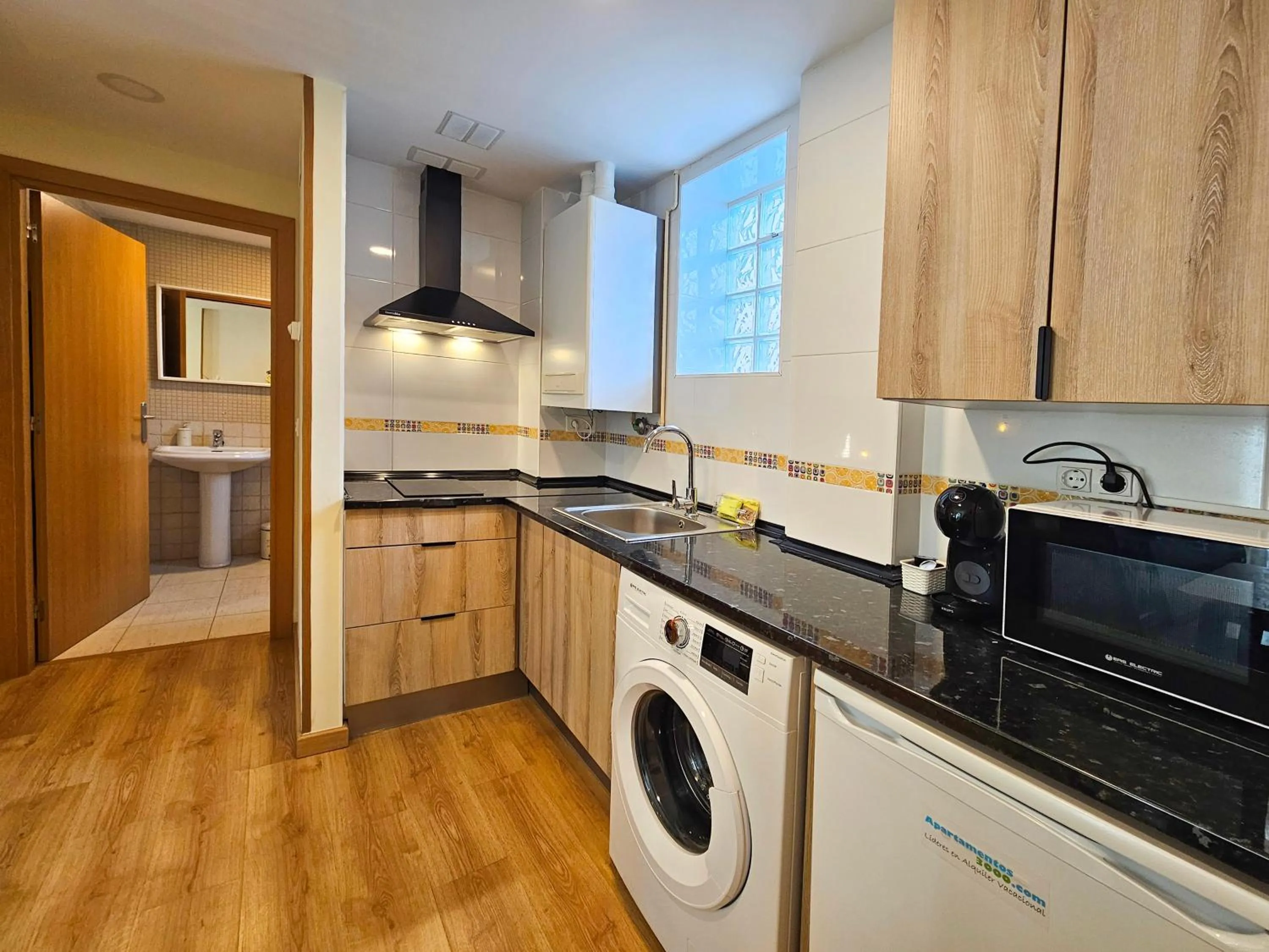 Kitchen or kitchenette in Apartamentos Escarrilla Suites 3000