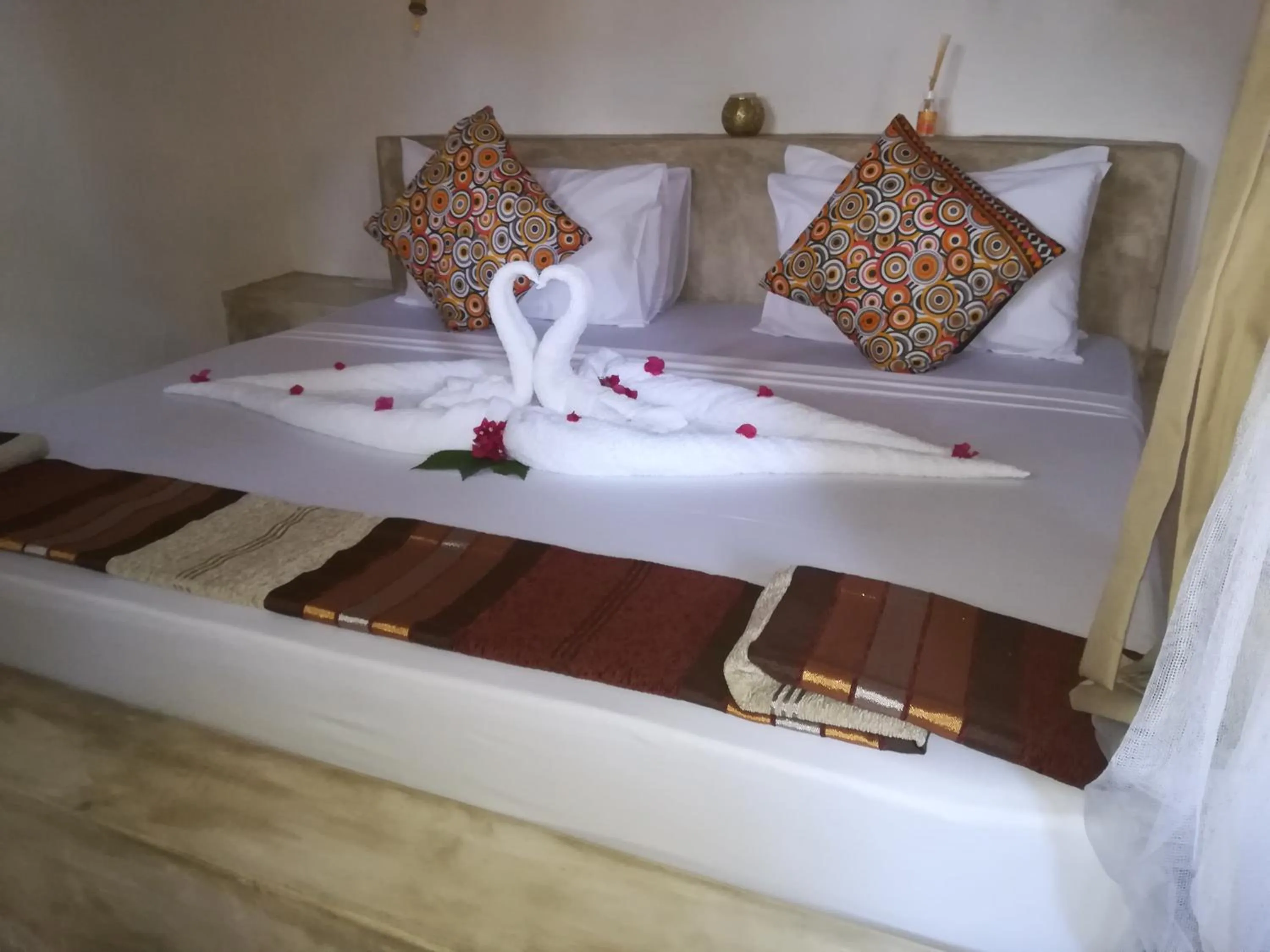 Bed in Bahari Beach Bungalows