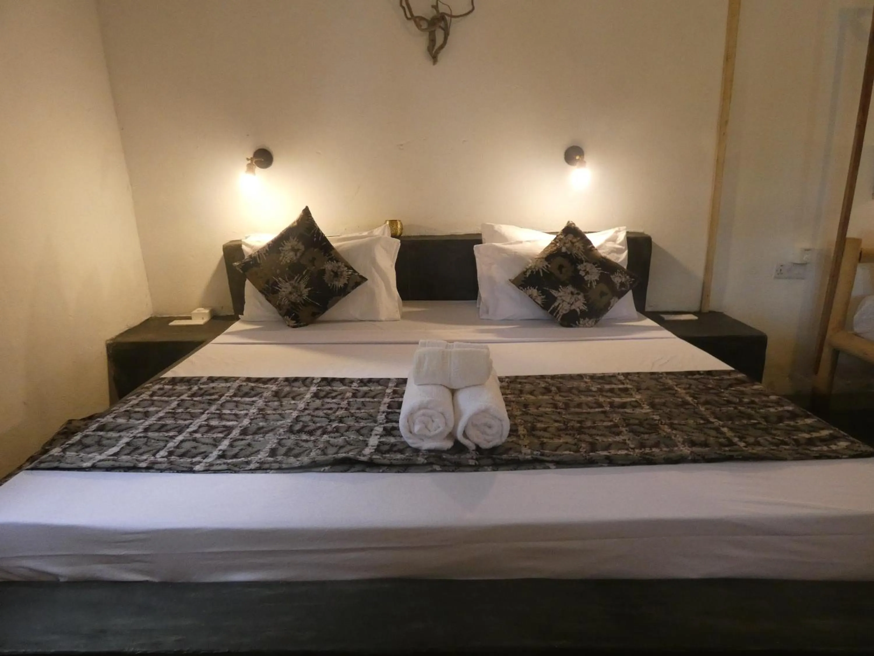 Bed in Bahari Beach Bungalows