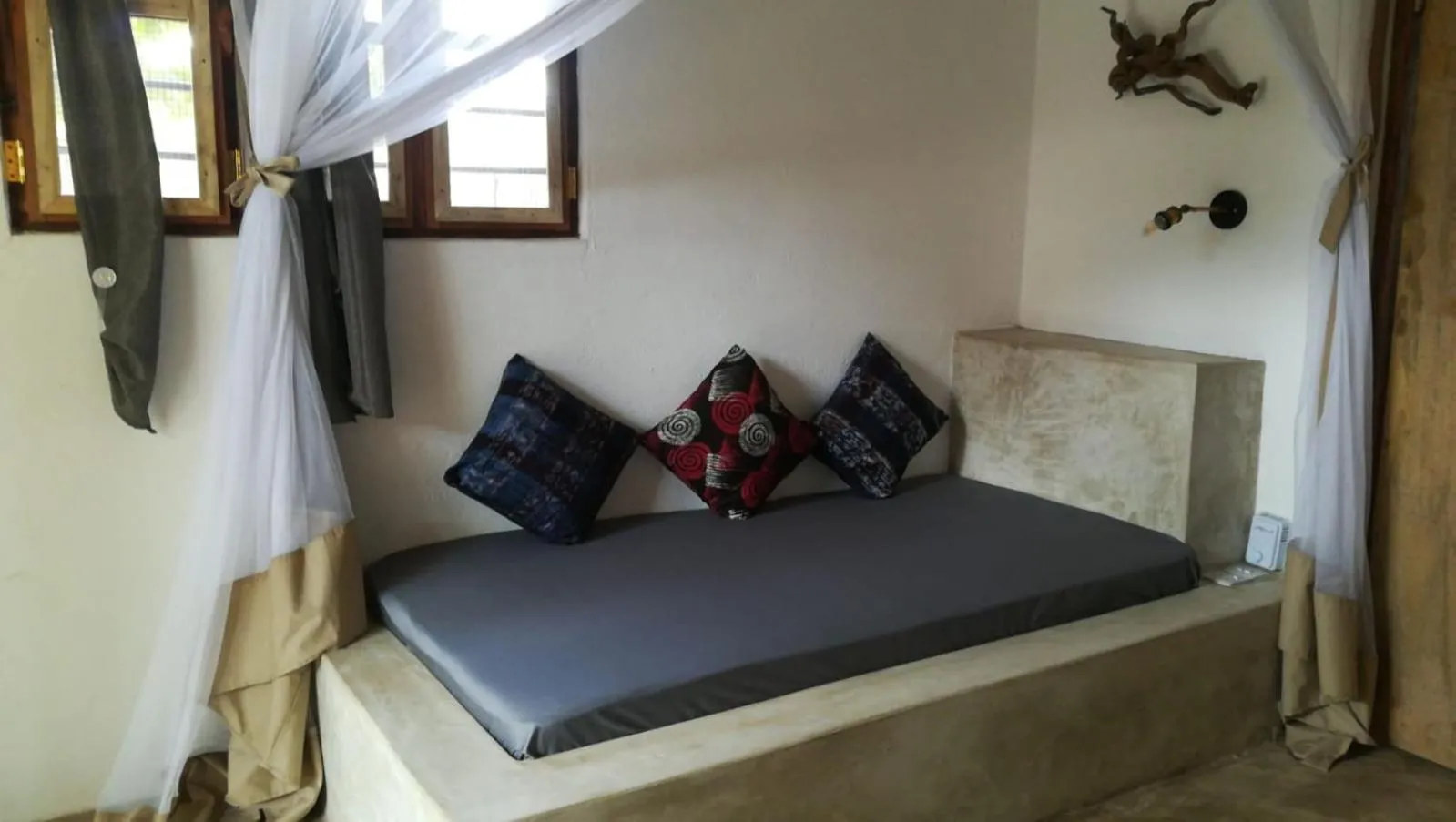 Bed in Bahari Beach Bungalows