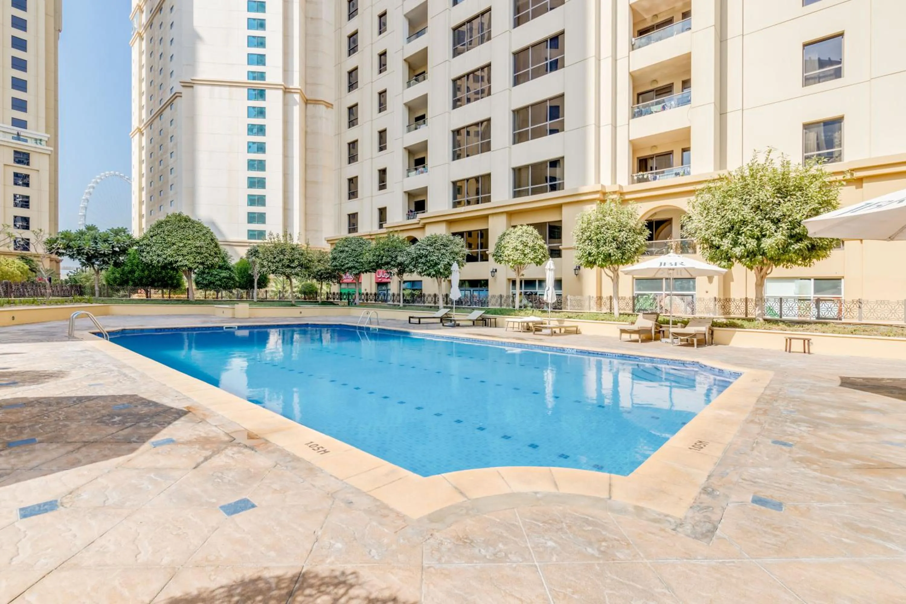 Swimming pool in GLOBALSTAY. Modern Apartments steps to JBR Beach