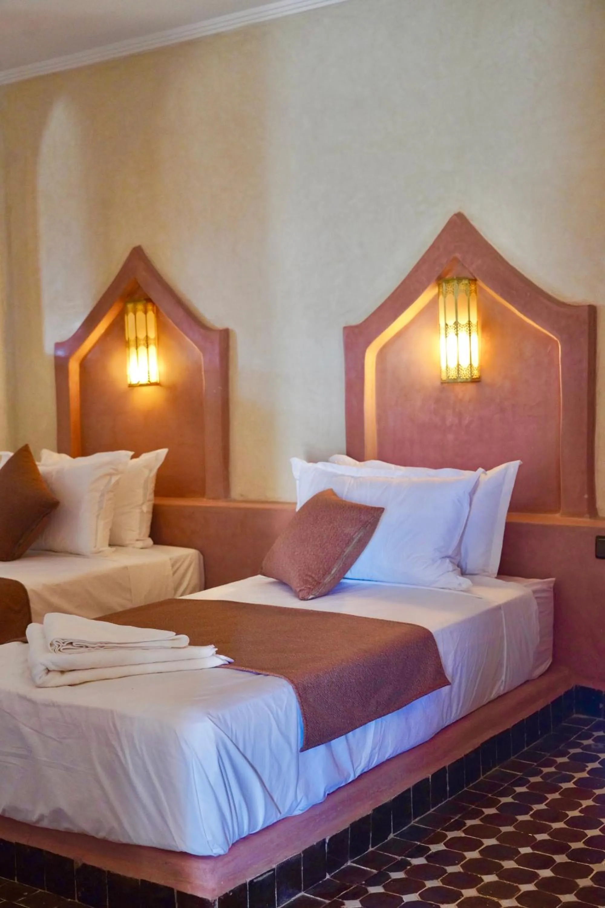 Bed in Hotel Sunset Palace