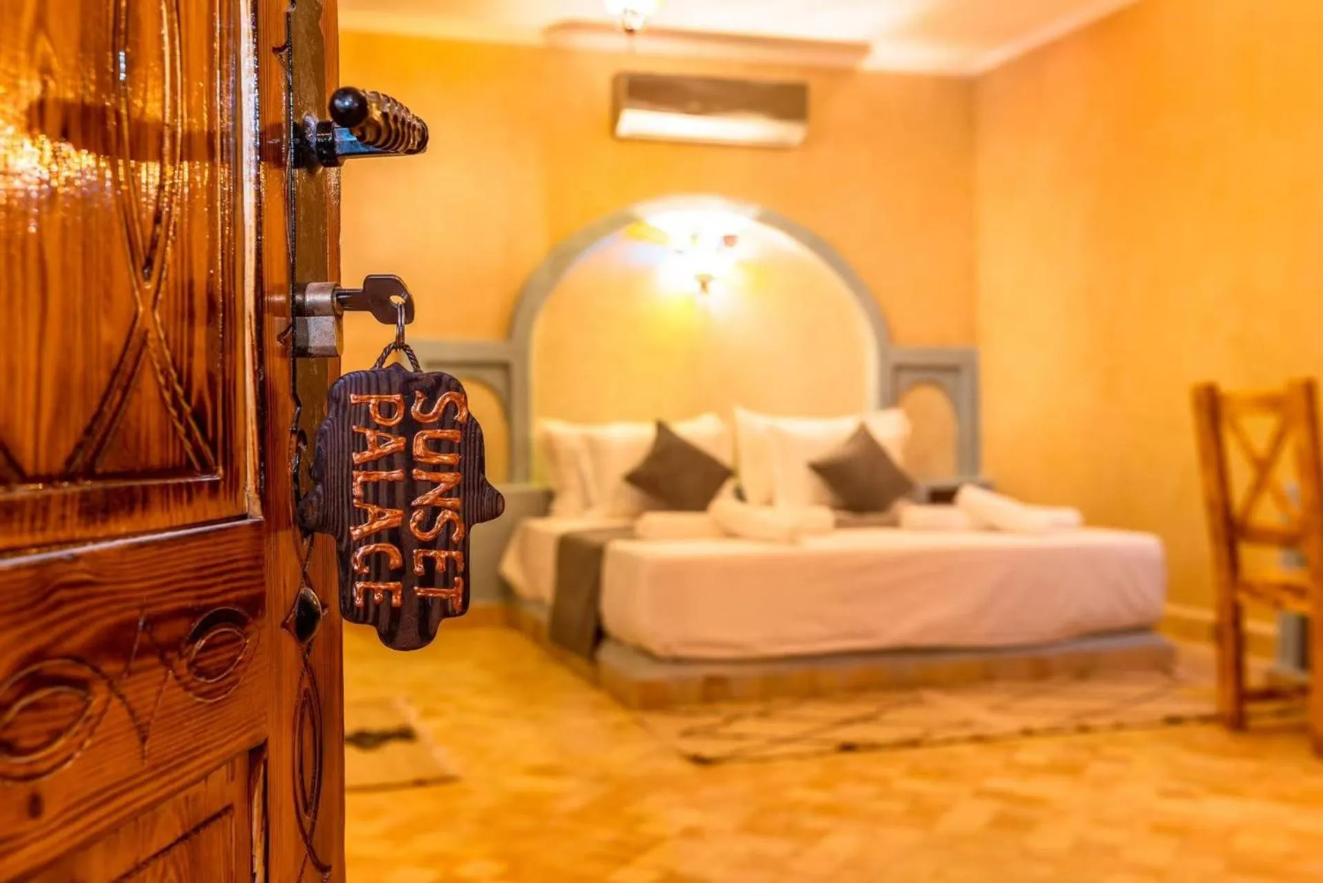 Bed in Hotel Sunset Palace